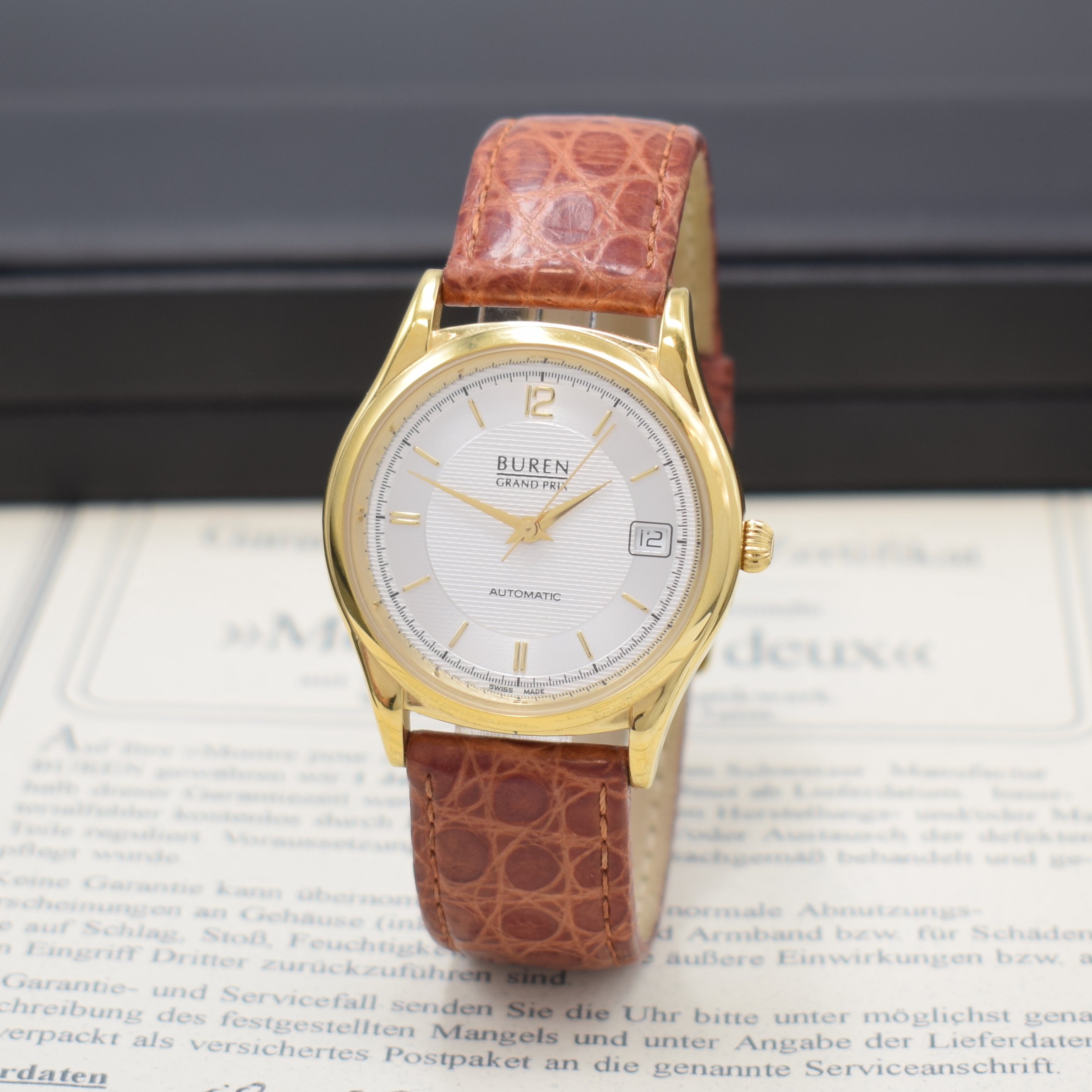 BUREN Grand Prix vergoldete Armbanduhr, Schweiz lt. orig. Pap. verk. 2001, Automatik, 2-tlg. Geh., Stahlboden aufgedr., silb. Duoton-Zifferbl., gold. ...