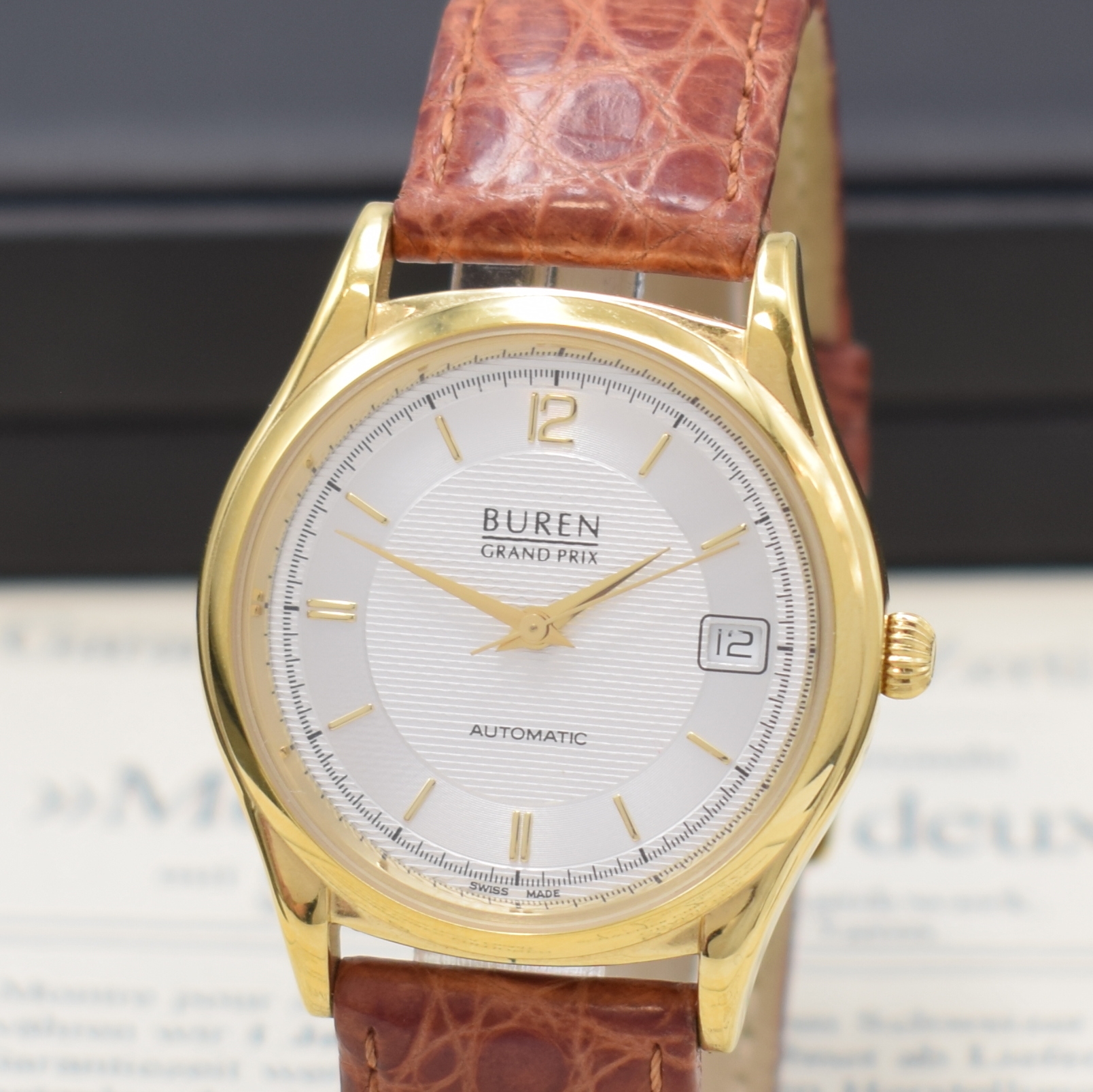 Detail a: BUREN Grand Prix vergoldete Armbanduhr, Schweiz lt. orig. Pap. verk. 2001, Automatik, 2-tlg. Geh., Stahlboden aufgedr., silb. Duoton-Zifferbl., gold. ...