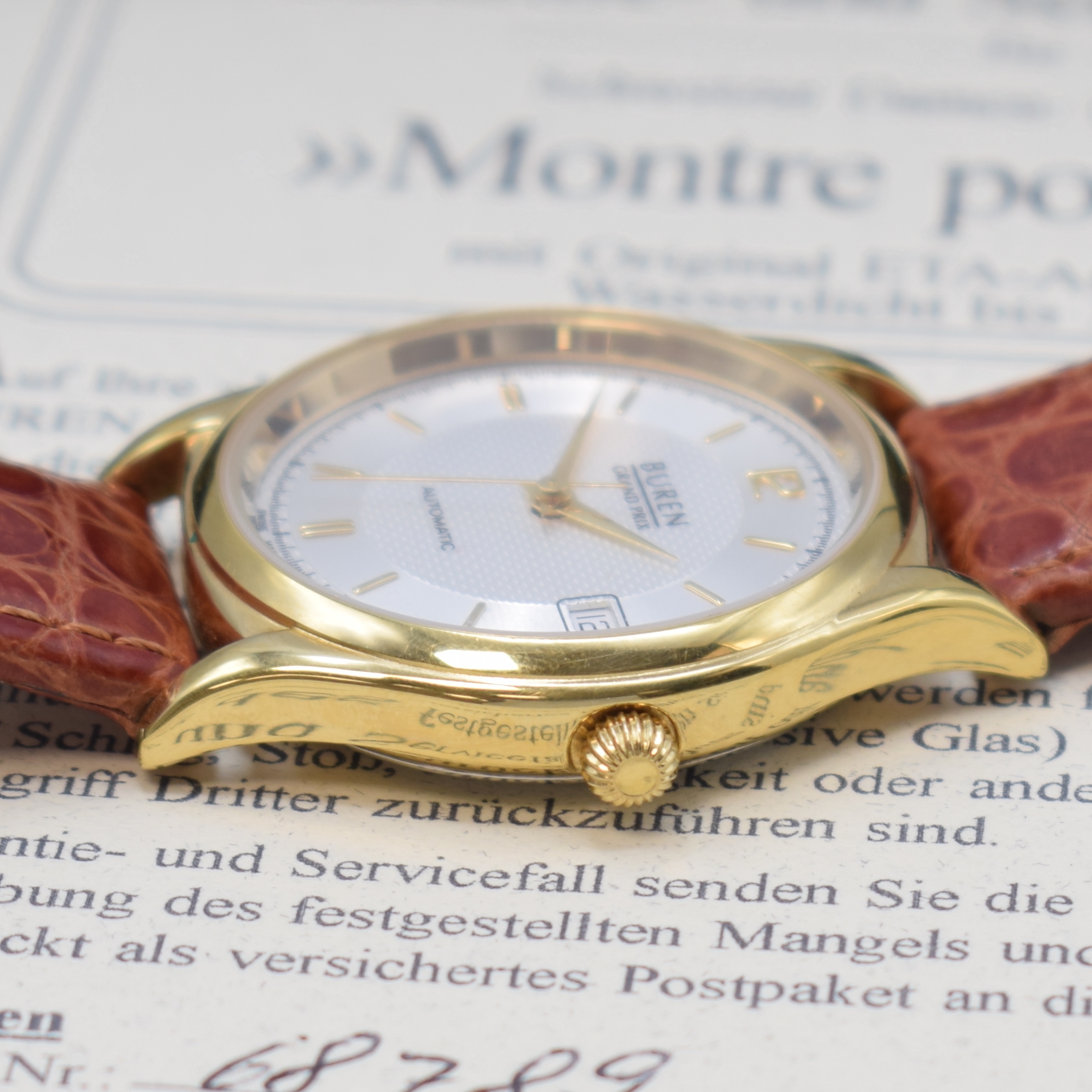 Detail b: BUREN Grand Prix vergoldete Armbanduhr, Schweiz lt. orig. Pap. verk. 2001, Automatik, 2-tlg. Geh., Stahlboden aufgedr., silb. Duoton-Zifferbl., gold. ...