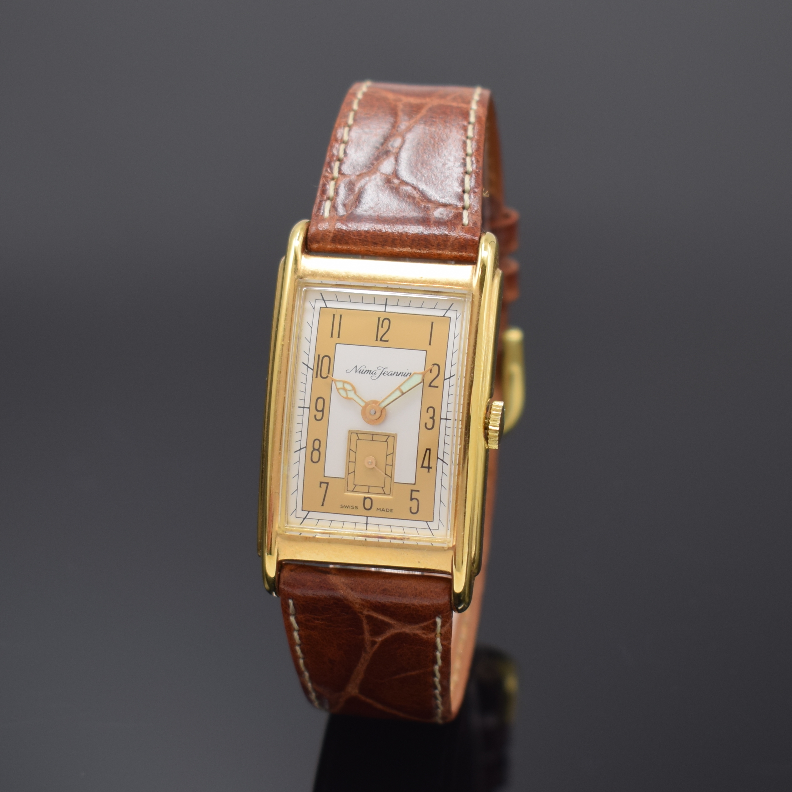 NUMA JEANNIN Armbanduhr, Schweiz um 1996, Design der 1930er Jahre, Handaufzug, verg. Metallgeh., Boden aufgedr., in sich leicht gewölbt, 2-farb. ...