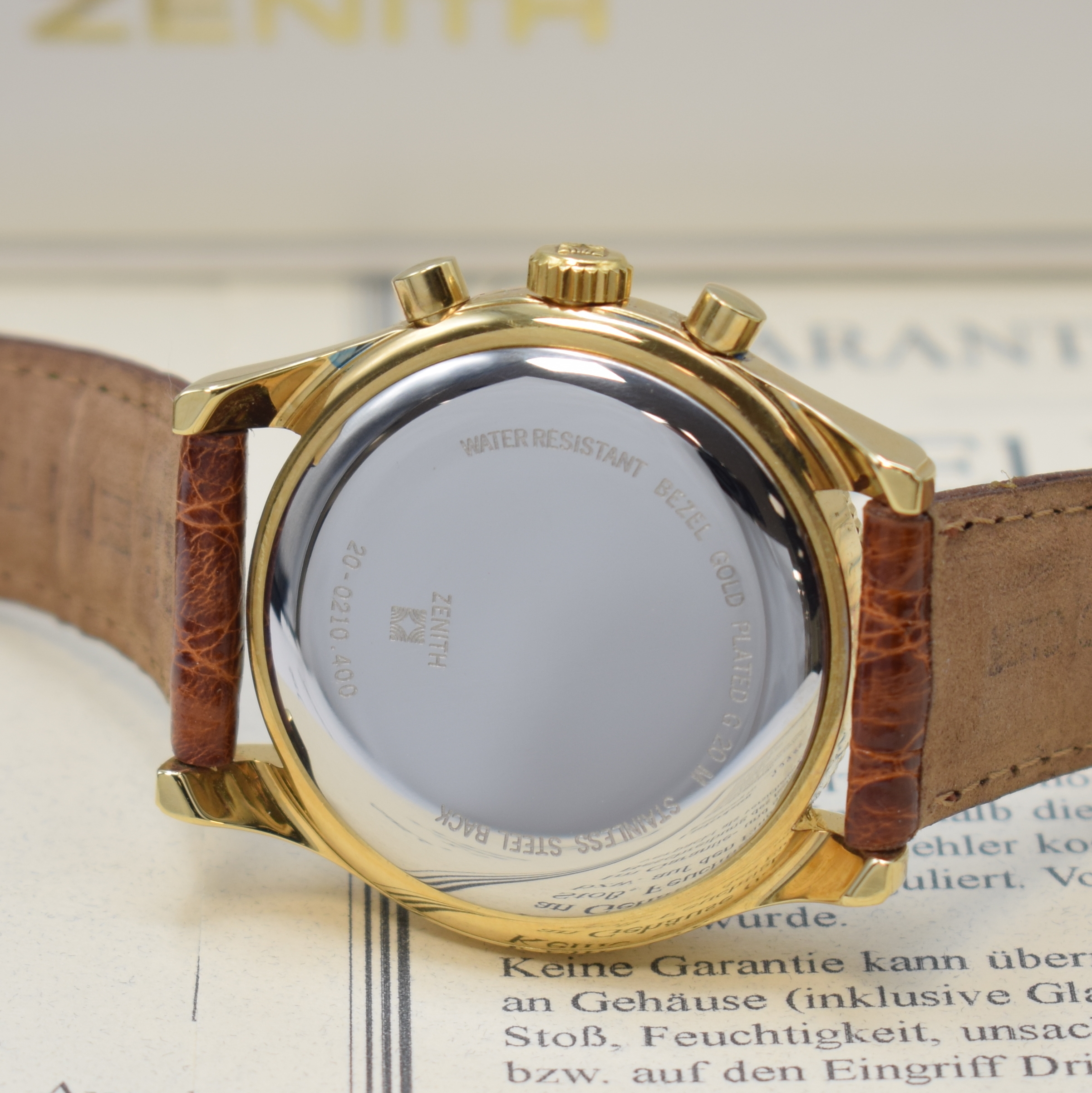 Detail d: ZENITH El Primero Schaltradchronograph Referenz 20-0210.400, Schweiz um 1995, Automatik, verg. Geh. m. aufgedr. Stahlboden, weisses Zifferbl., gold. ...