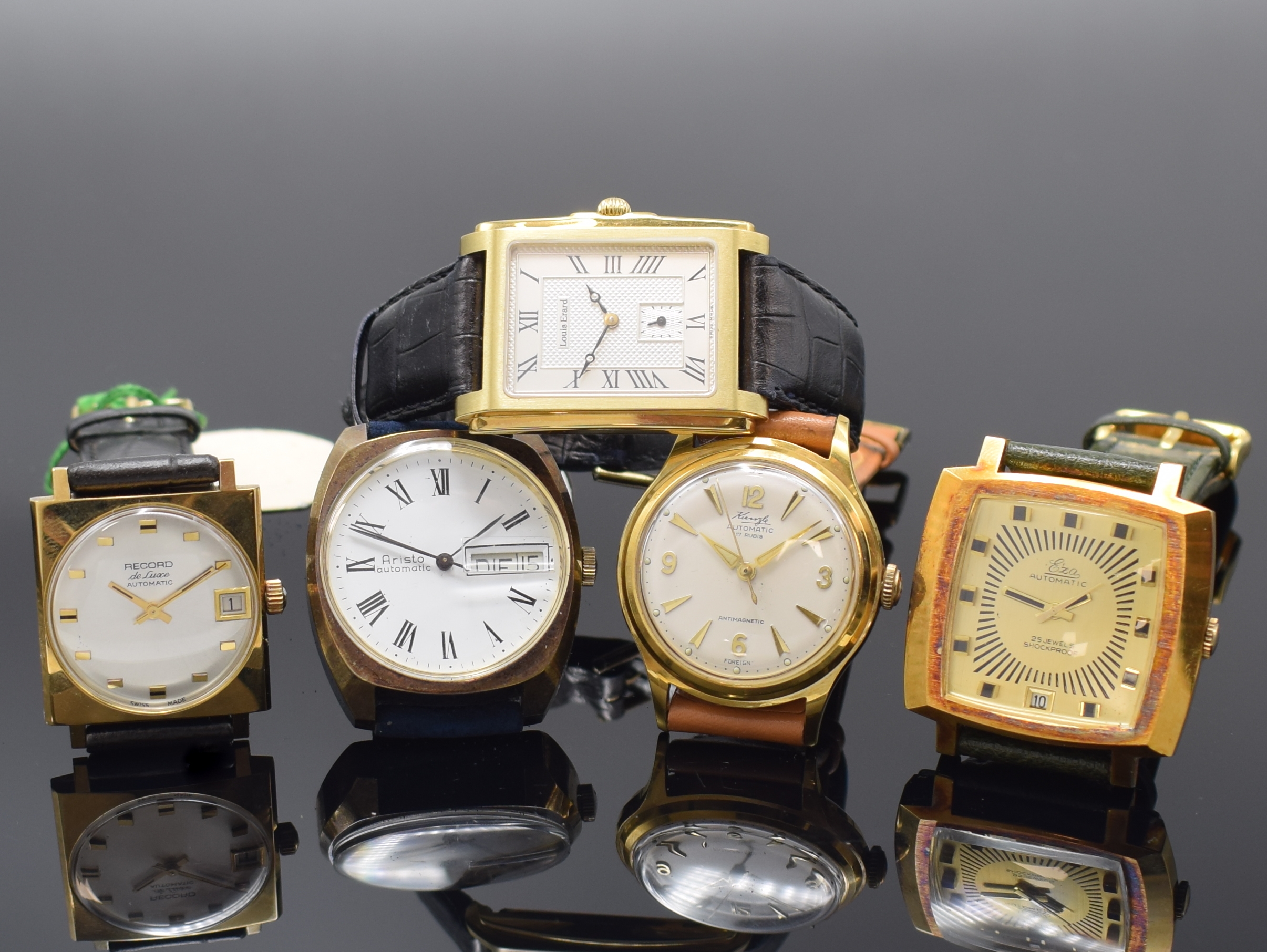 Konvolut: 5 vergoldete Armbanduhren, 4 x Automatik, 1.) Aristo mit Tag und Datum, Boden aufgedr., 25 St., Kal. PUW 1564, D. ca. 36 mm, 2.) EZA mit ...