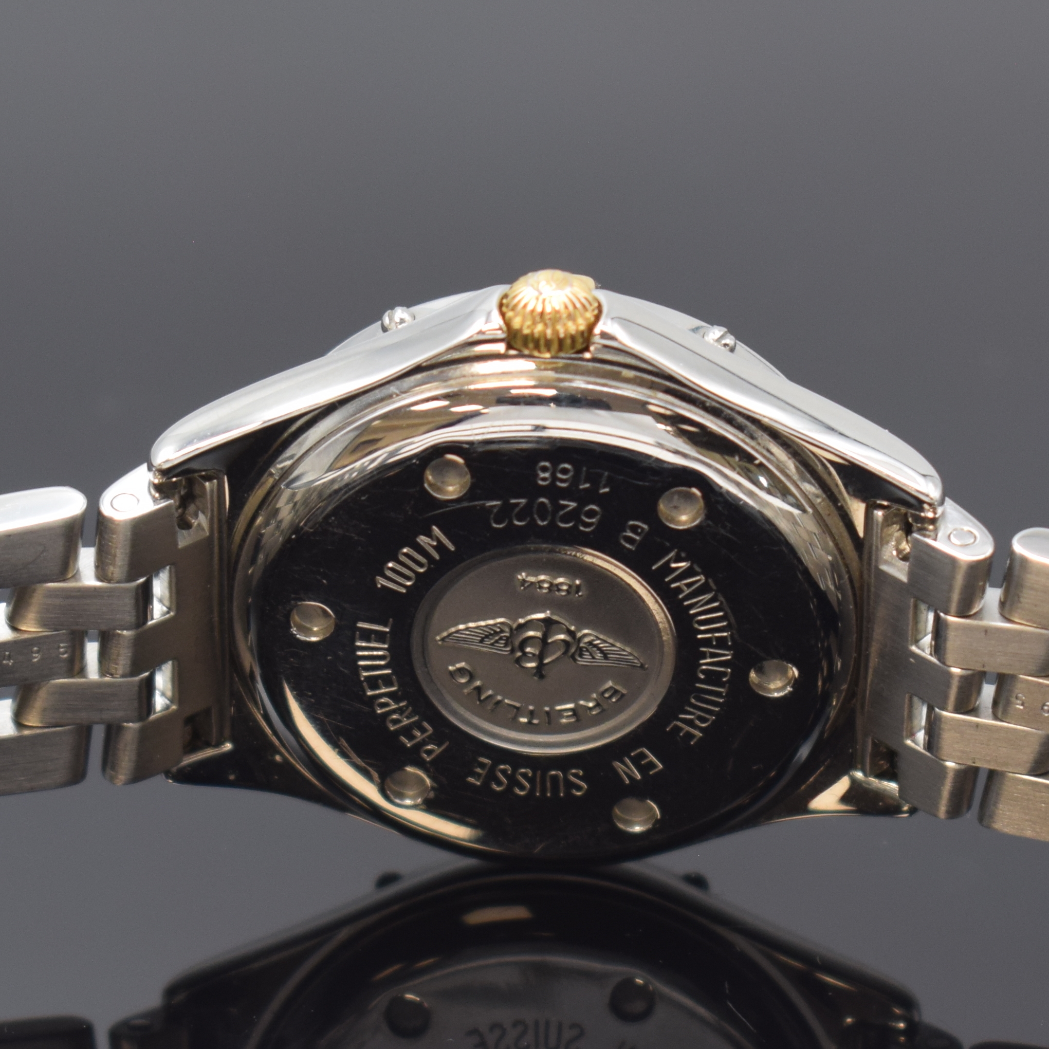 Detail d: BREITLING Damenarmbanduhr Serie Perpetual Sirius Referenz B62022, Schweiz um 1995, Edelstahl/Gold kombiniert inkl. Pilotband m. Faltschl., Boden ...
