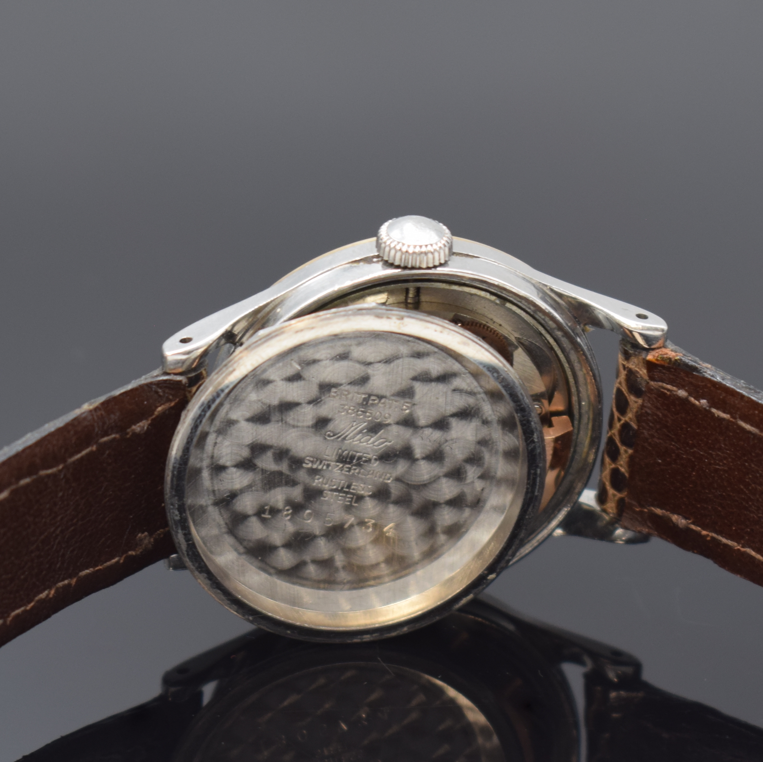Detail f: MIDO Multifort Powerwind Herrenarmbanduhr, Schweiz um 1958, Edelstahlgeh., Boden verschr., Goldlünette aufgedr., schwarzes Zifferblatt altersbed. ...