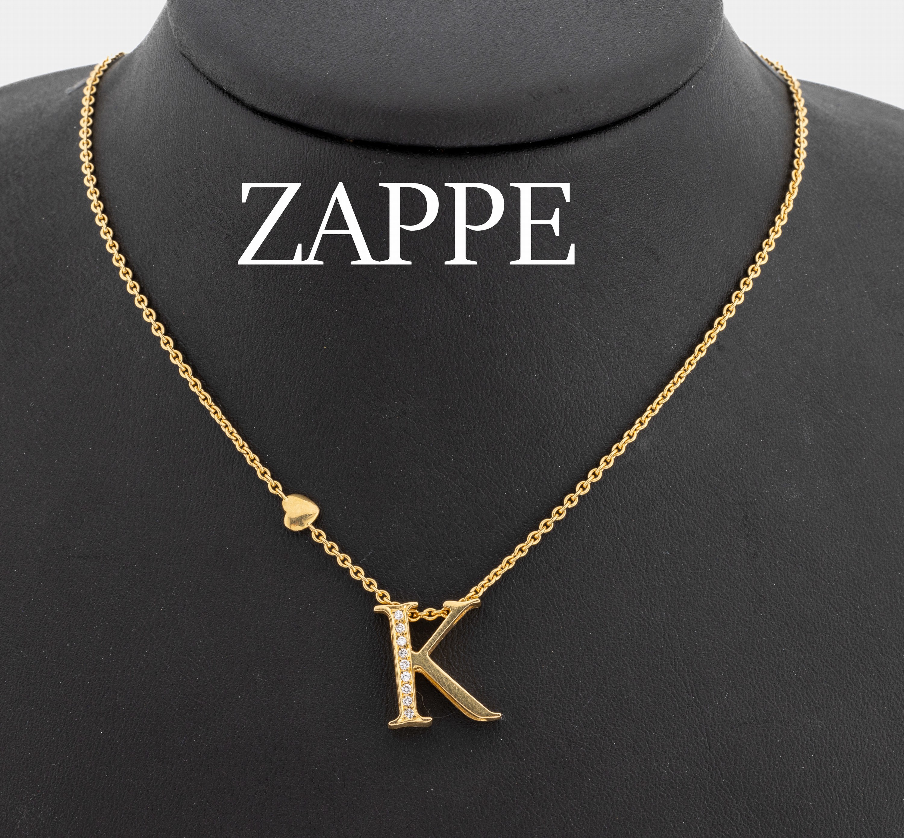 18 kt Gold Brillant-Collier "K", GG 750/000, Meistermarke WERNER ZAPPE Pforzheim, 9 Brillanten zus. ca. 0.08 ct (grav.) feines Weiß/vs, ...