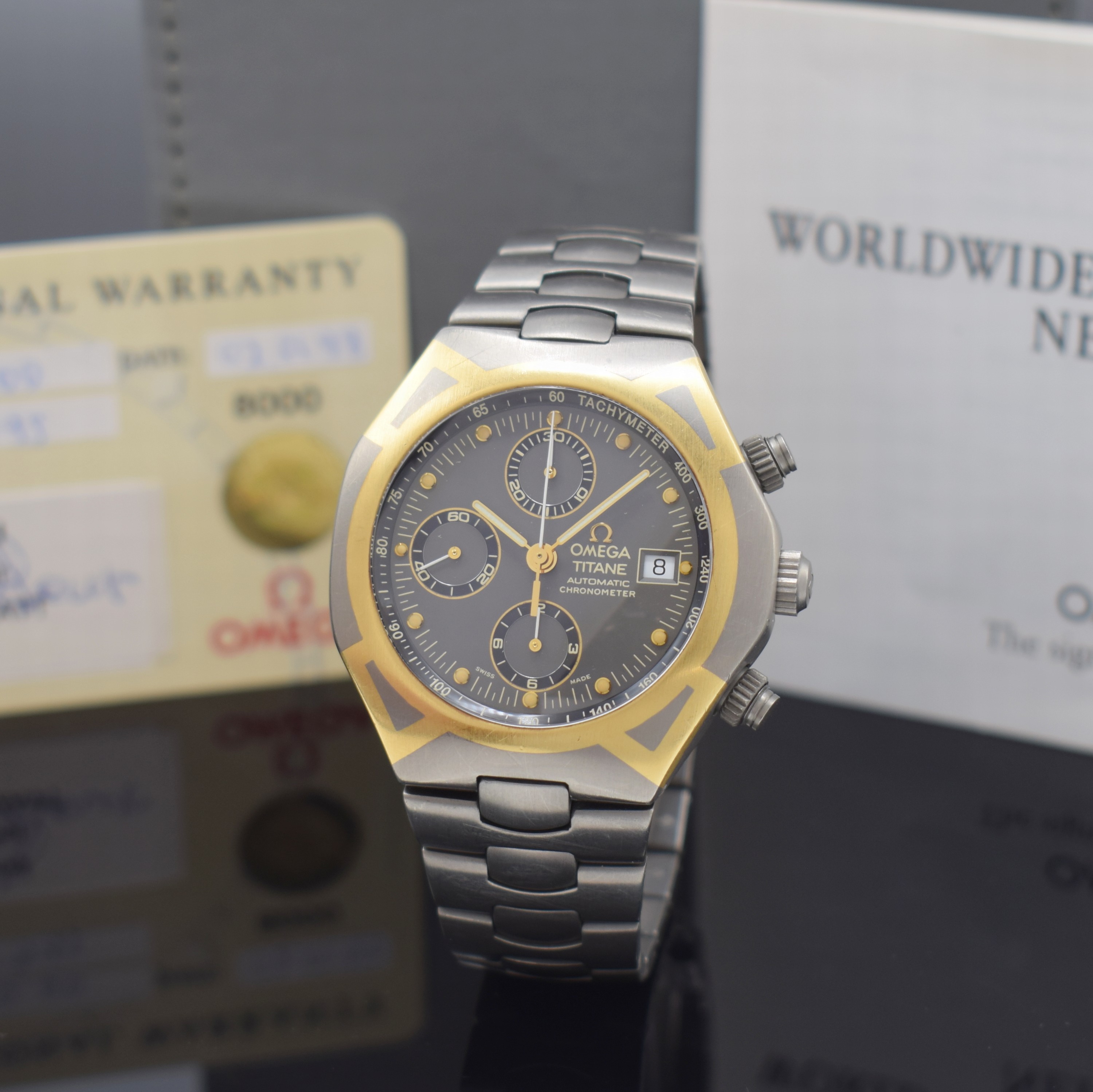 OMEGA Armbandchronograph Titane Referenz 58944000, Automatik, Chronometer in Titan inkl. Titanband m. dopp. Faltschl., Boden m. Goldlogo aufgedr., ...
