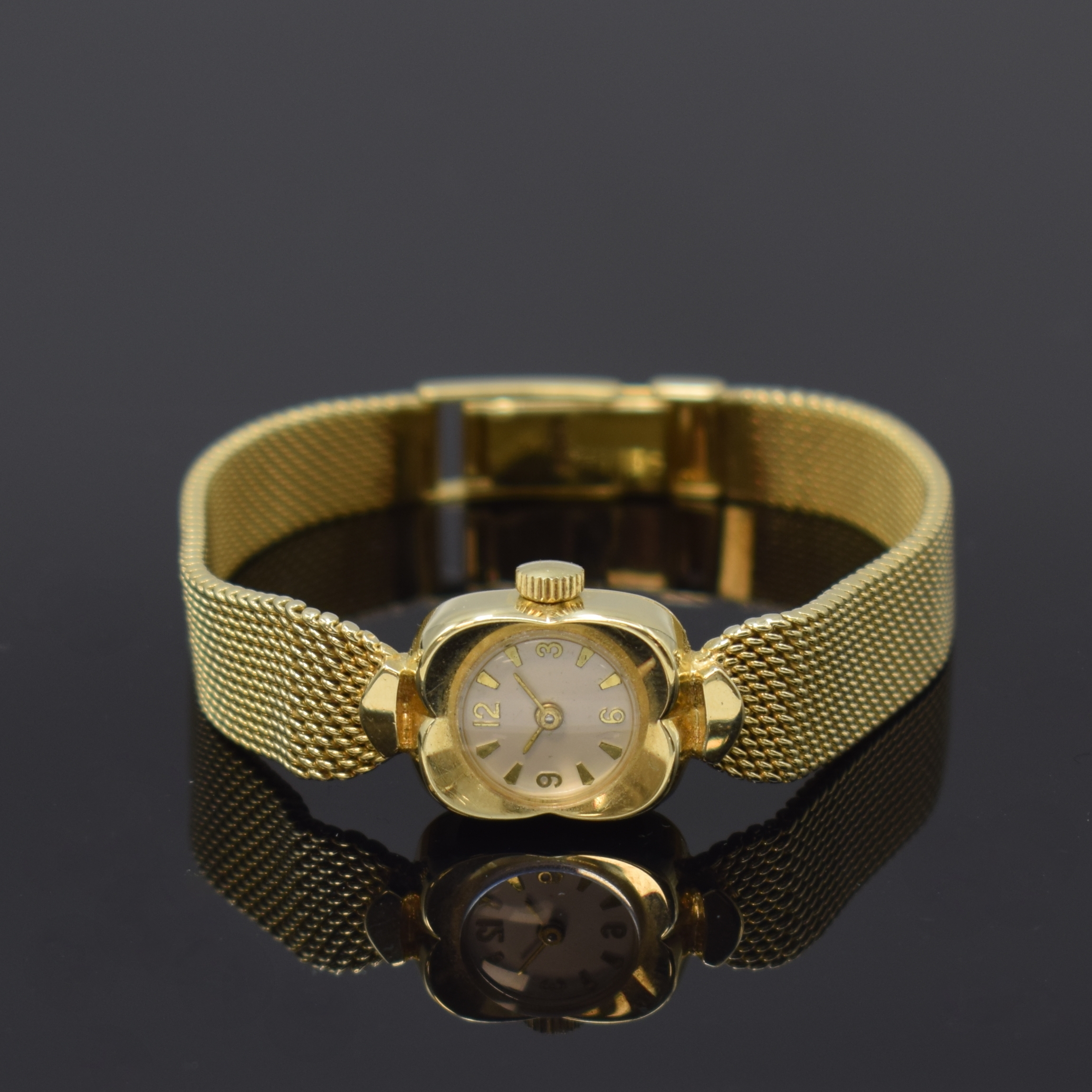 Damenarmbanduhr in GG 585/000, Schweiz um 1965, Handaufzug, Boden aufgedr., silb. Zifferbl. m. gold. Std.-Ind., gold. Zeiger, Kal. FEF 6650, 17 St., ...