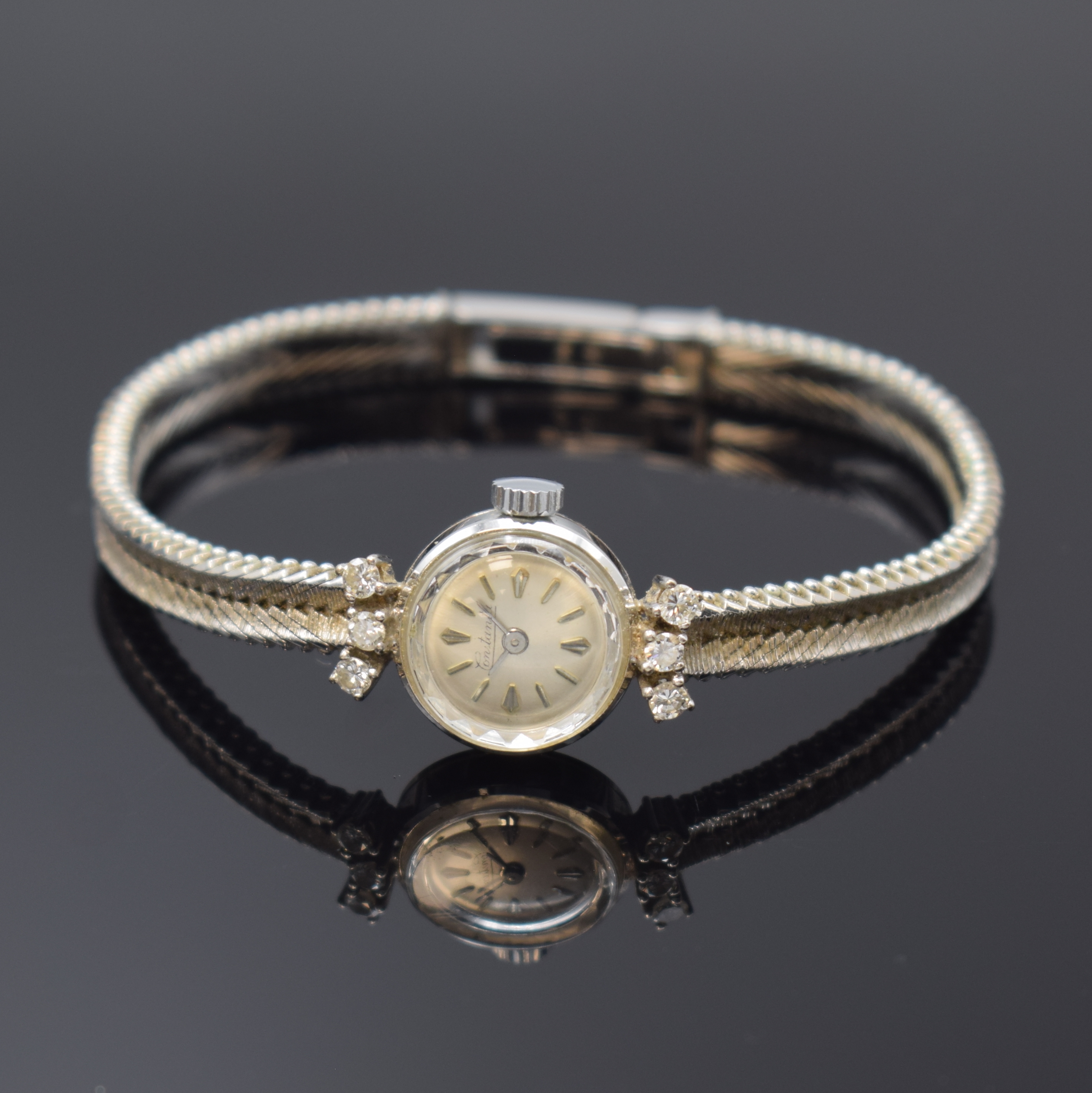 CONSTANTA Damenarmbanduhr in WG 750/000 mit Diamanten, Schweiz um 1965, Handaufzug, Boden aufgedr., 6 Diamanten, silb. Zifferbl. m. silb. Std.-Ind., ...