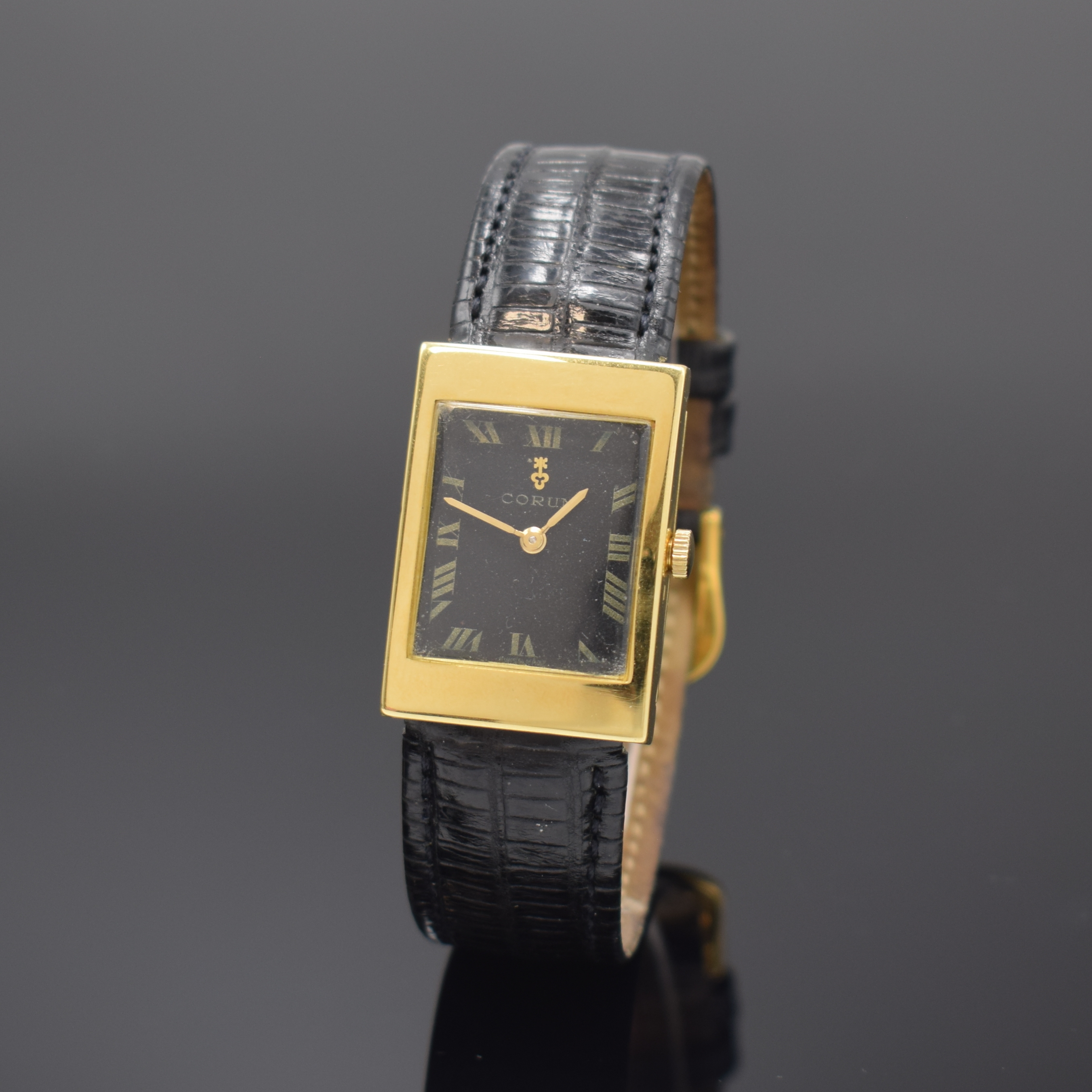 CORUM Damenarmbanduhr in GG 750/000 Referenz 8003, Schweiz um 1970, Handaufzug, 2-tlg. Geh., Boden aufgedr., verd. Bandanst., schwarzes Zifferbl. m. ...