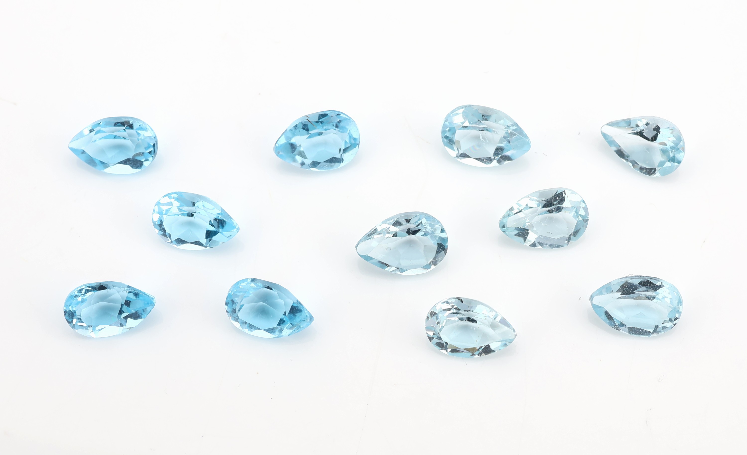 Lot 11 lose facett. Topase, zus. 9.66 ct, facett. Tropfen in versch. Größen und Farbnuancen