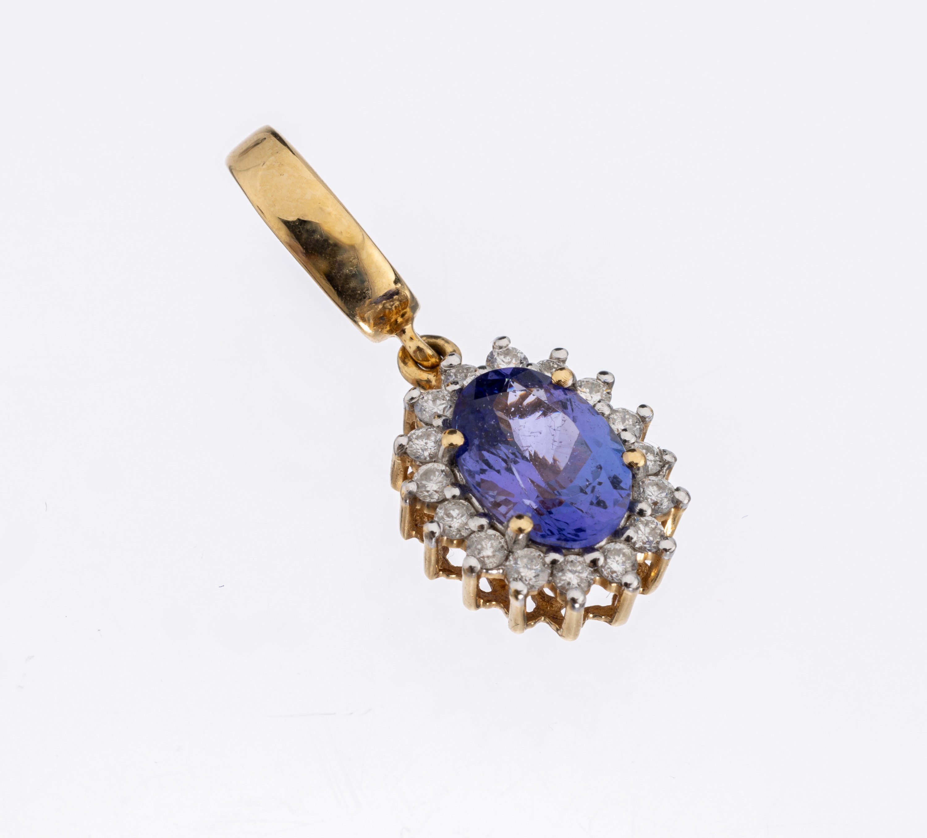 18 kt Gold Tansanit-Brillant-Clipanhänger, GG 750/000, ovalfacett. Tansanit ca. 1.15 ct, umgeben von 16 Brillanten zus. ca. 0.25 ct Weiß/p