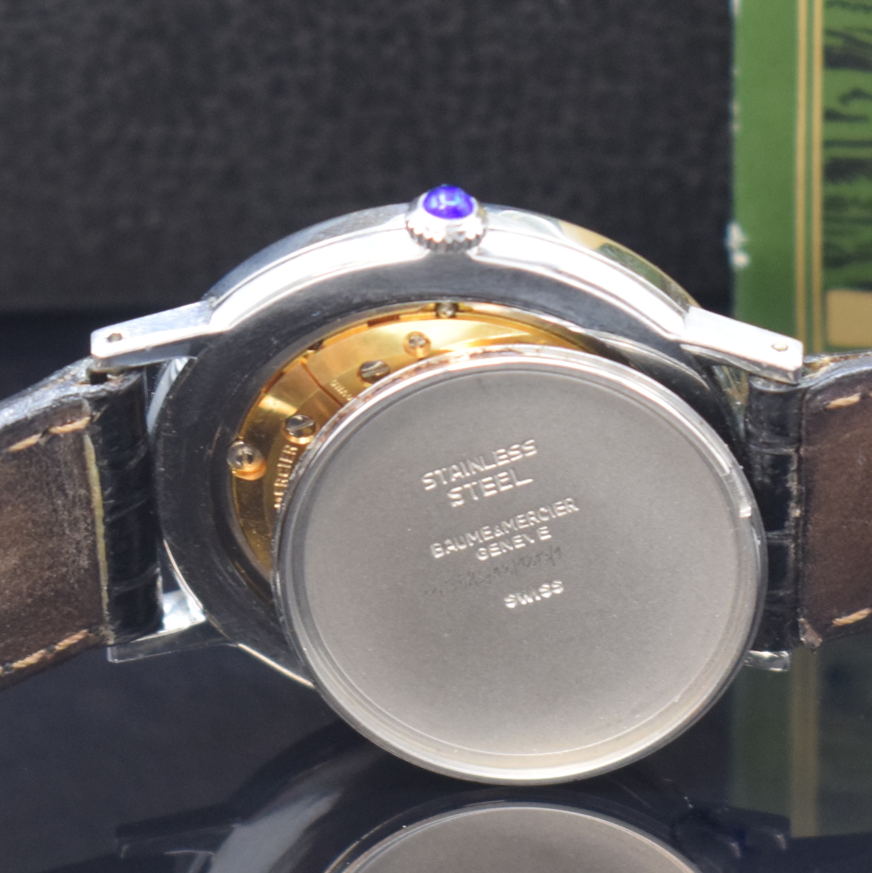 Detail e: BAUME & MERCIER Armbanduhr in Stahl Referenz 1530, Schweiz um 1977, Handaufzug, Boden aufgedr., Schmuckkrone, silb. Zifferbl. m. silb. Std.-Ind. u. ...