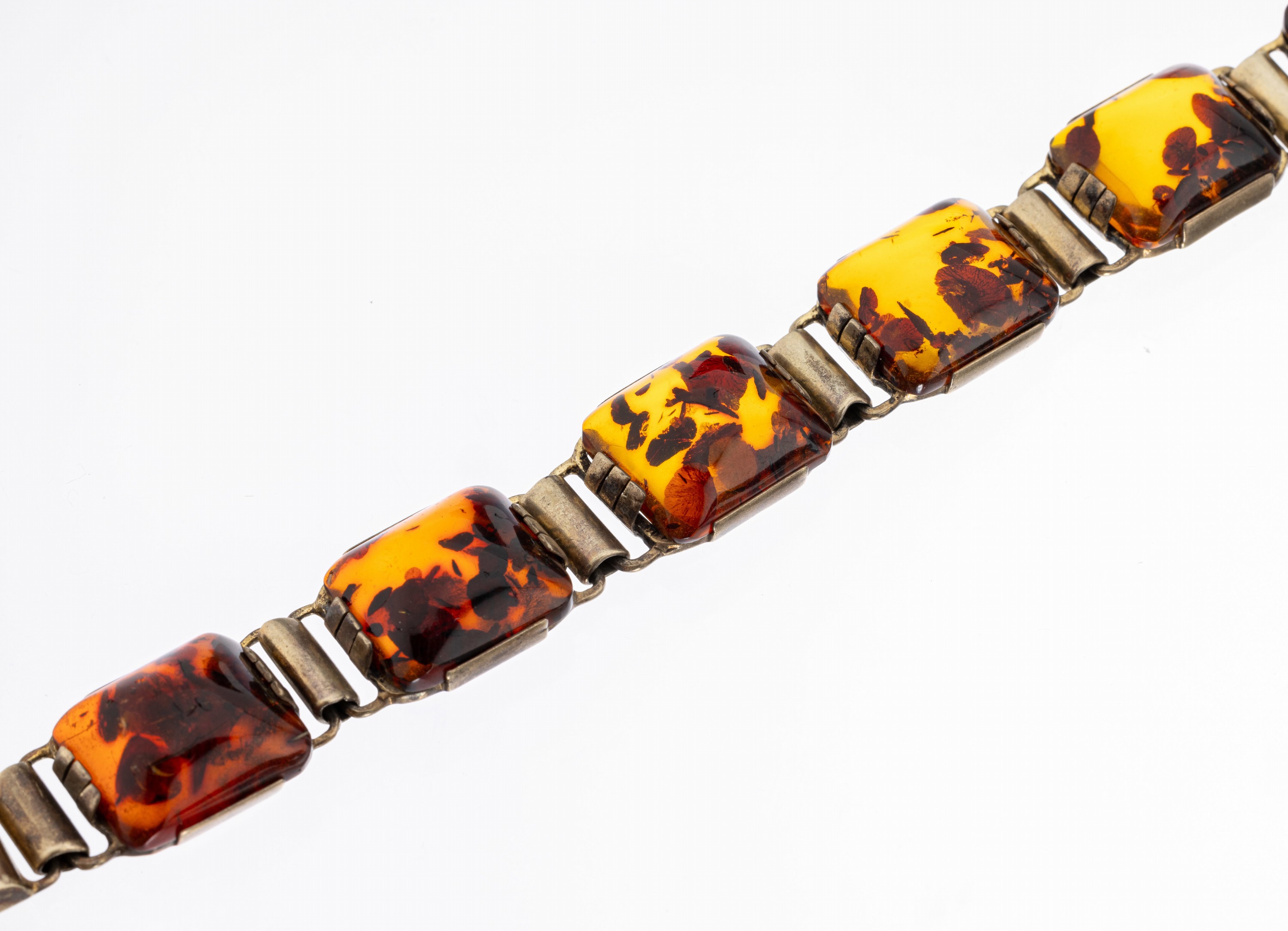 Art-Deco-Armband, 830er Silber vergoldet, um 1930, deutsch, Bernstein mit Inclusen, L. ca. 17.5 cm, Kastenschloss mit Sicherheitsacht