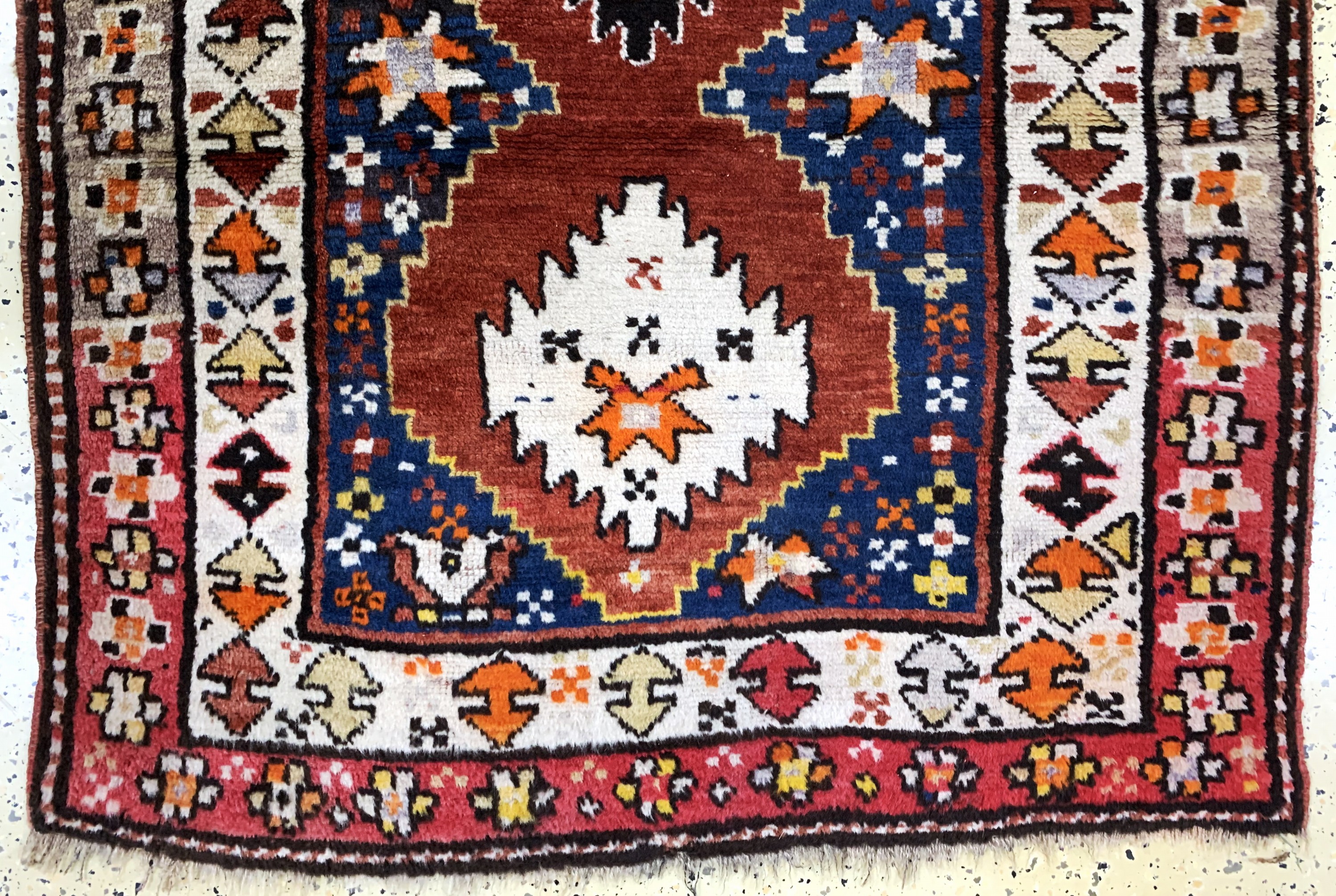 Detail b: Antiker Kazak, Kaukasus, um 1900, Wolle aufWolle, ca. 190 x 110 cm, EHZ: 3
