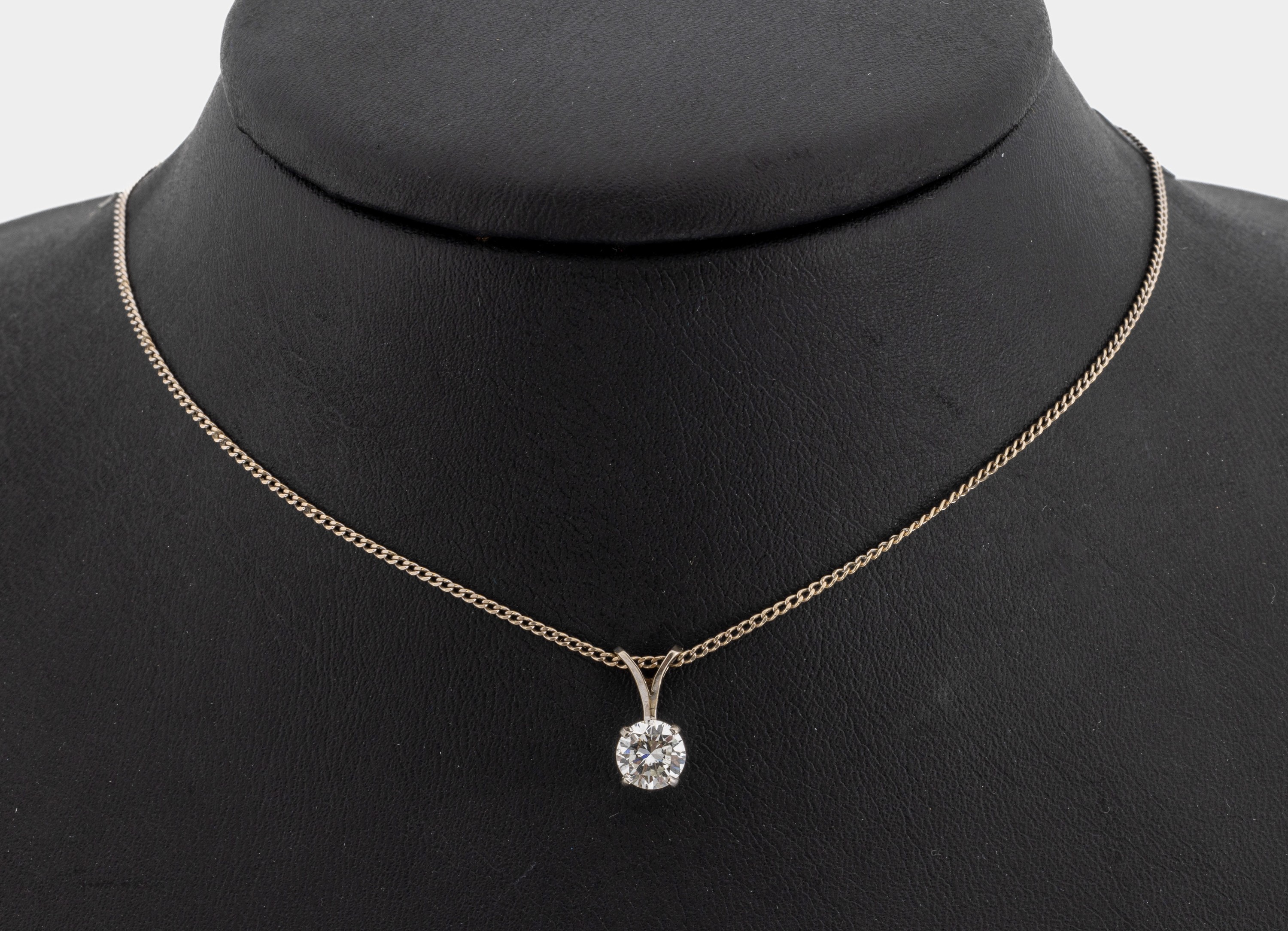 14 kt Gold Brillant-Anhänger, WG 585/000, Brillant ca. 0.75 ct Weiß/si, an Kette, L. ca.40 cm, Federringschließe sec., ca. 2.5 g