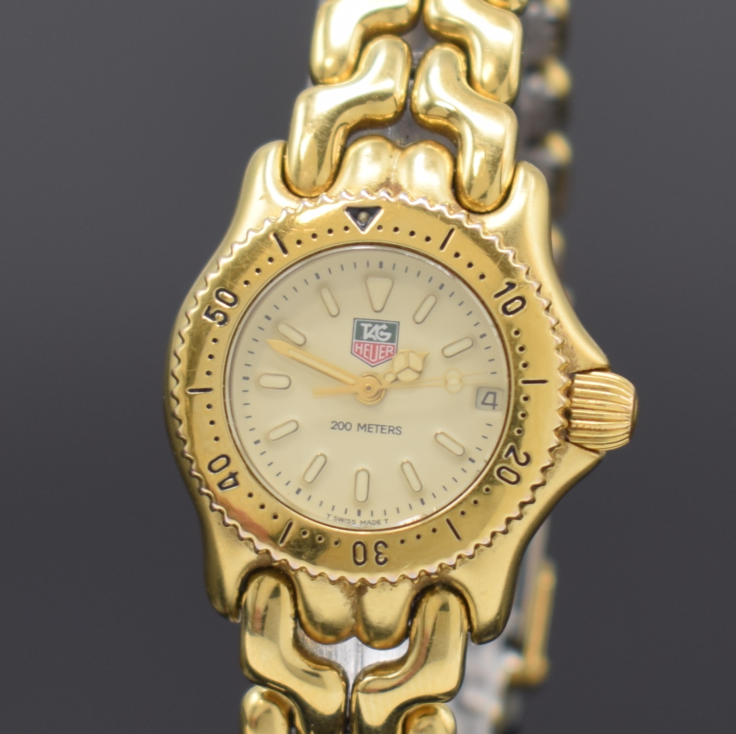 Detail a: TAG HEUER Damenarmbanduhr Referenz S94.708M,Schweiz um 1995, quarz, verg. Geh., inkl. Gliederband m. Faltschl., Boden verschr., Lünette m. 60er ...