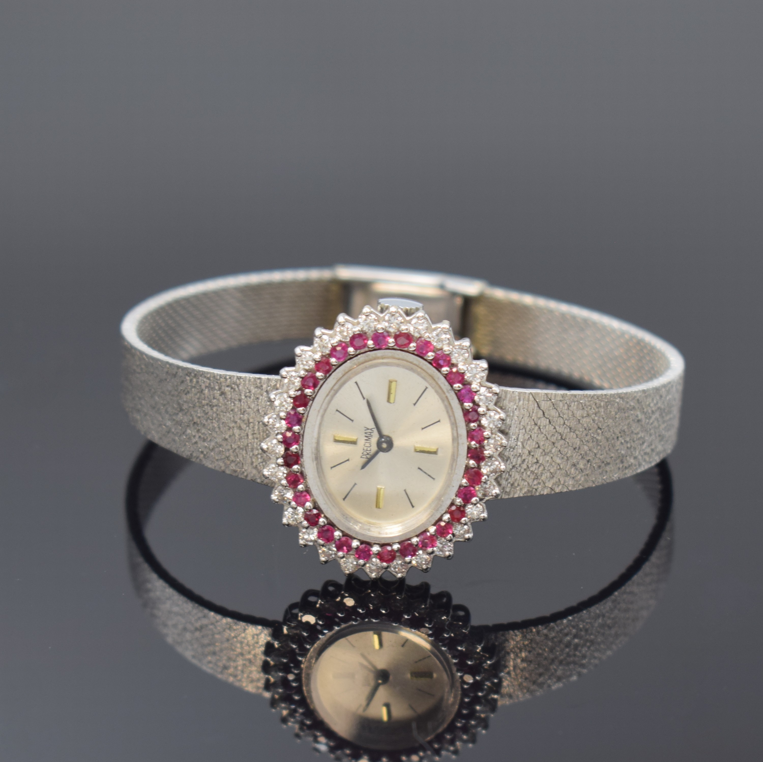 PRECIMAX Damenarmbanduhr in WG 585/000 mit Diamanten und Rubinen, Schweiz um 1970, Handaufzug, Boden aufgedr., Lünette aufw. m. Diamanten u. Rubinen ...