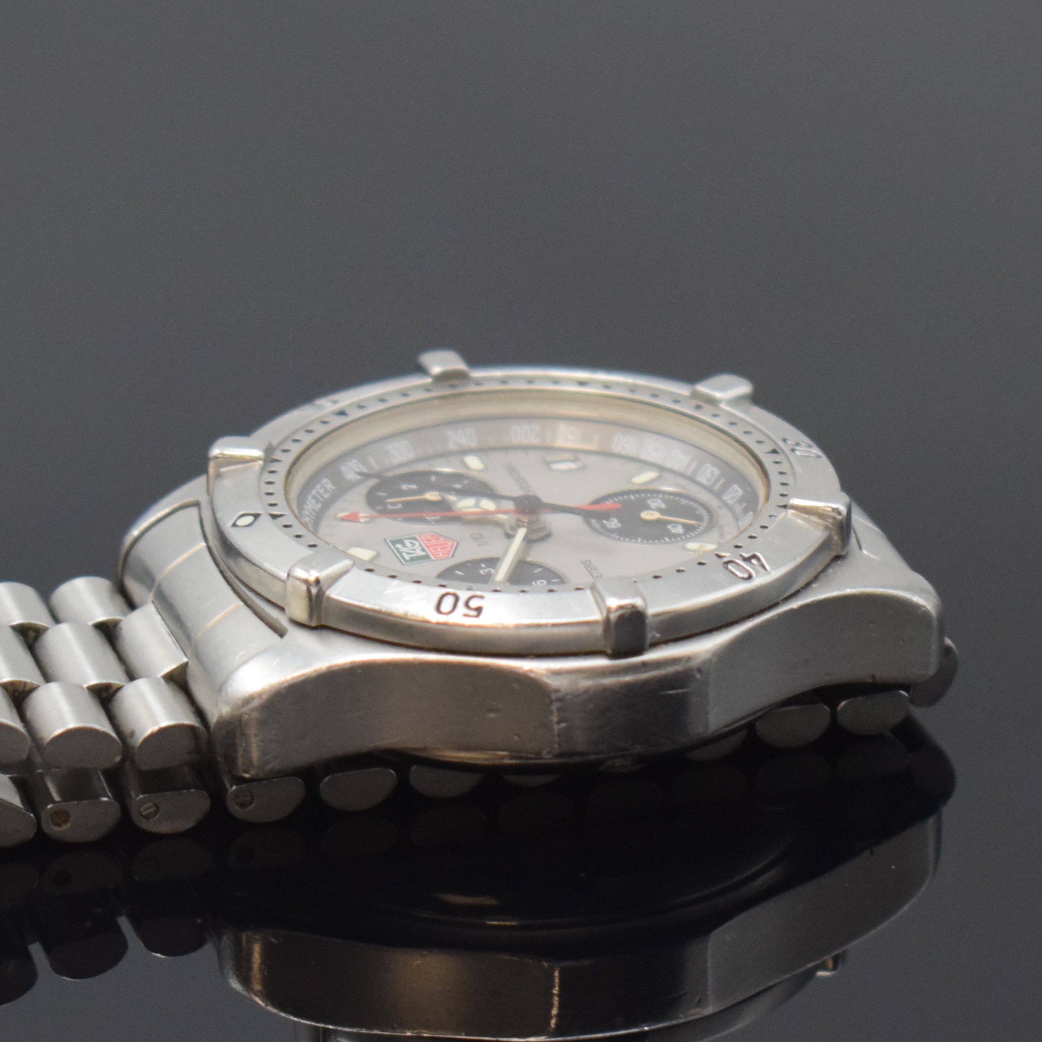 Detail d: TAG HEUER Professional Herrenarmbanduhr in Stahl Referenz CE1111, Schweiz um 1995, quarz, Boden u. Krone verschr., orig. Gliederband m. Faltschl., ...