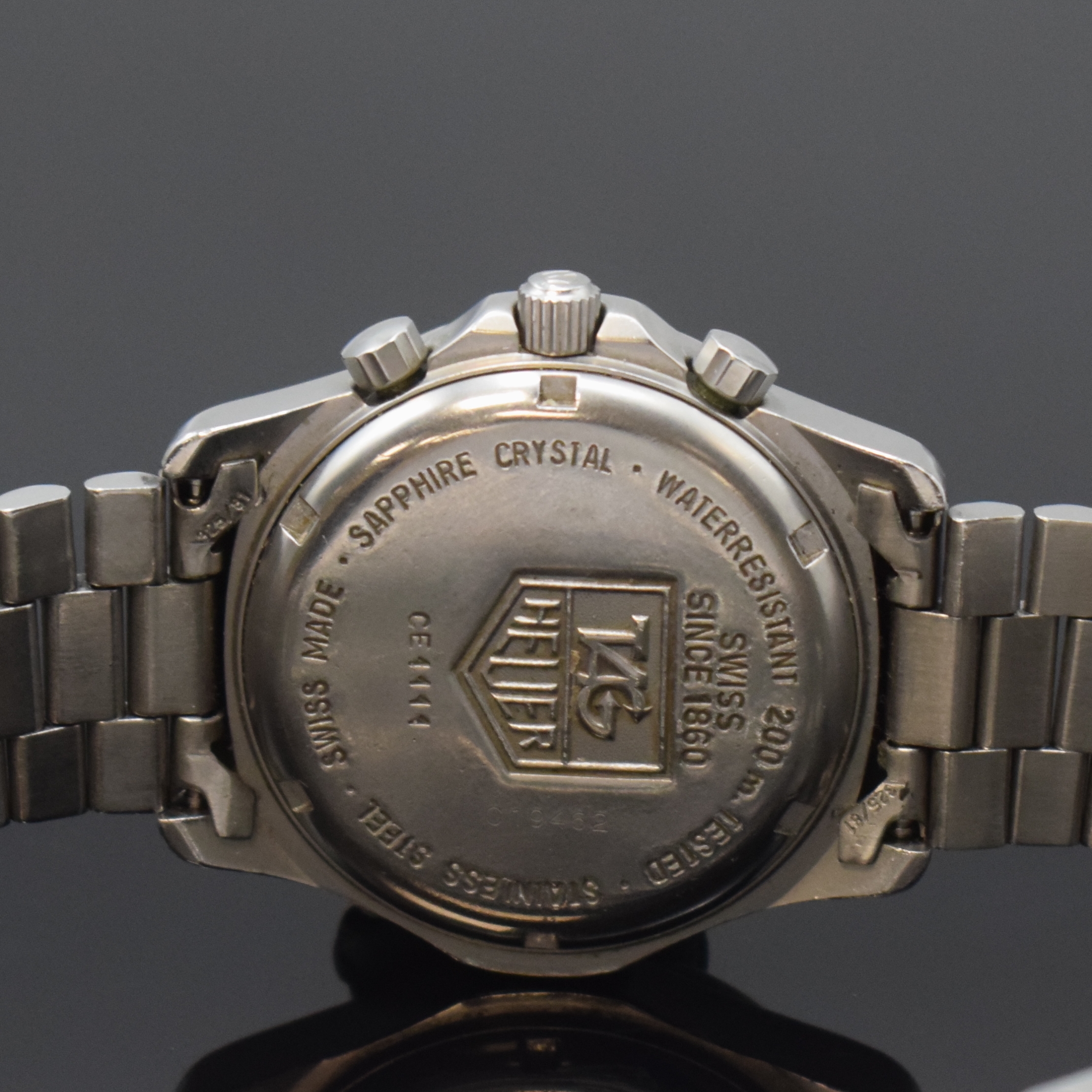 Detail e: TAG HEUER Professional Herrenarmbanduhr in Stahl Referenz CE1111, Schweiz um 1995, quarz, Boden u. Krone verschr., orig. Gliederband m. Faltschl., ...