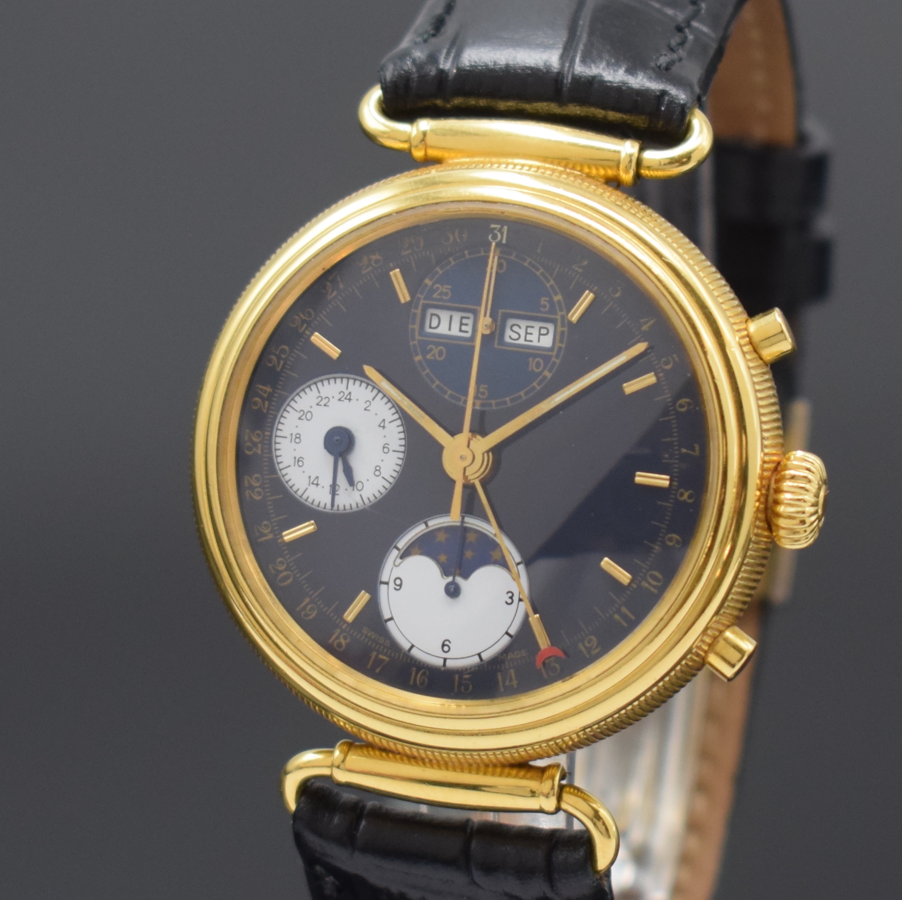 Detail a: Herrenarmbanduhr mit Chronograph und Vollkalender, Schweiz um 1995, Automatik, beids. vergl. Geh., Boden aufgedr., Korrekturdrücker seitl. im Geh. ...