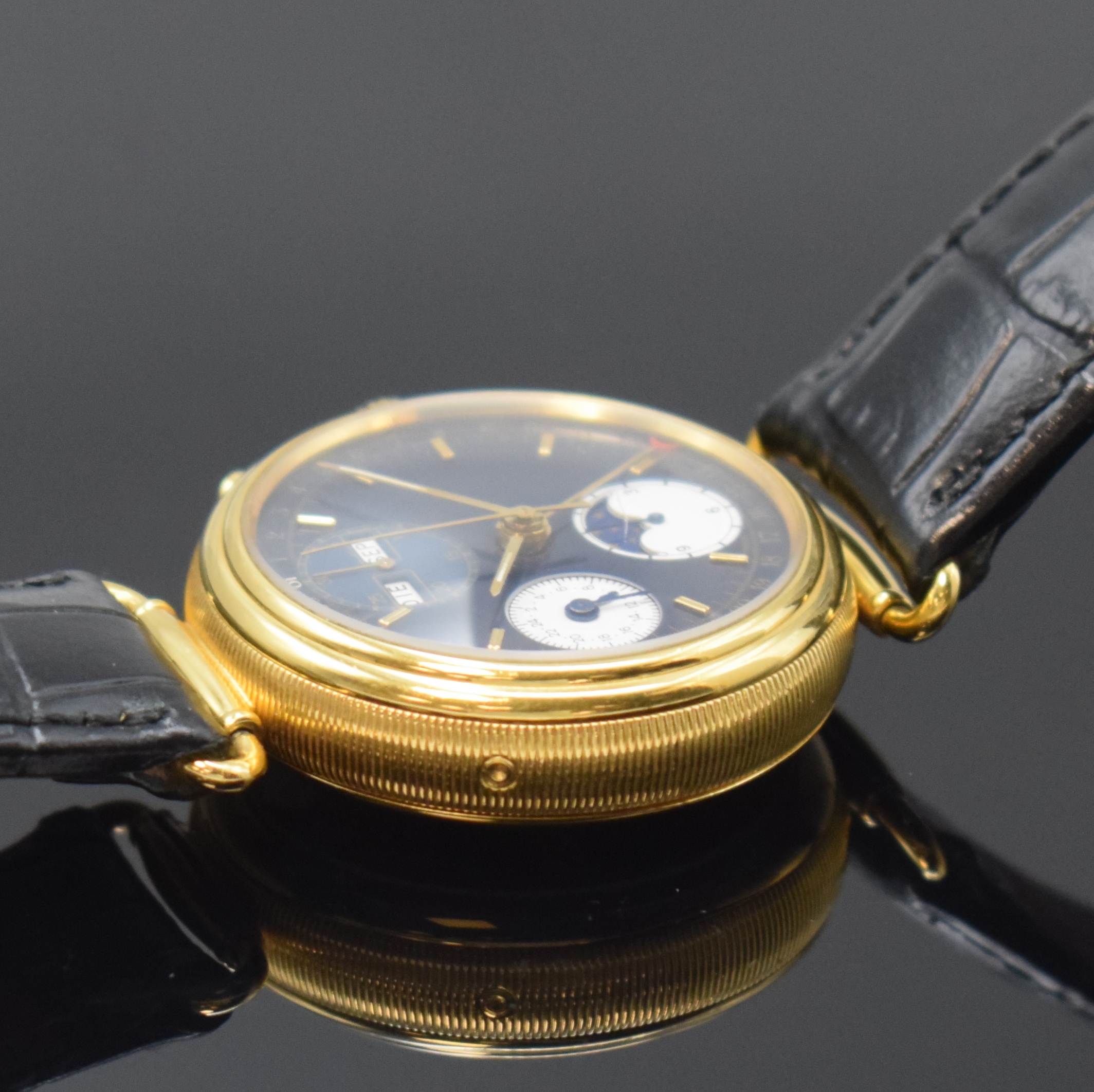 Detail d: Herrenarmbanduhr mit Chronograph und Vollkalender, Schweiz um 1995, Automatik, beids. vergl. Geh., Boden aufgedr., Korrekturdrücker seitl. im Geh. ...