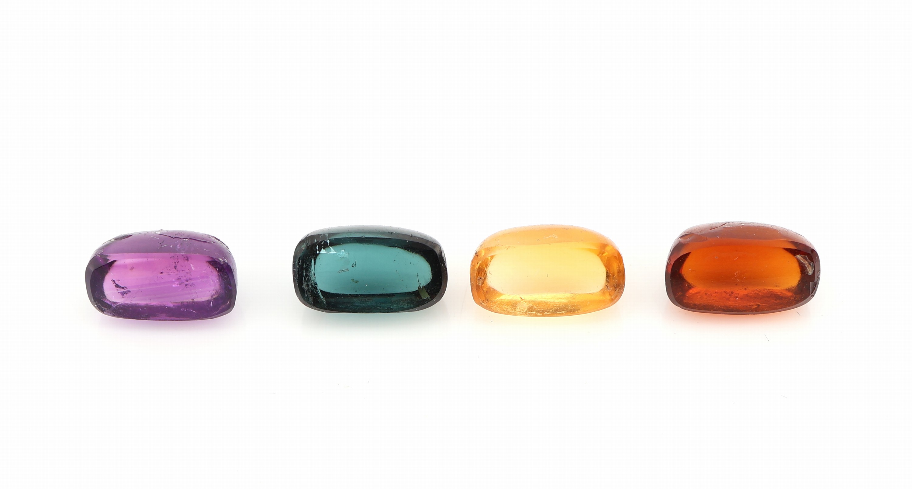 Detail b: Lot 13 lose Farbsteine, zus. ca. 23.78 ct, Turmaline, Amethyste und Citrine, längliche Cabochons, Ausfassware