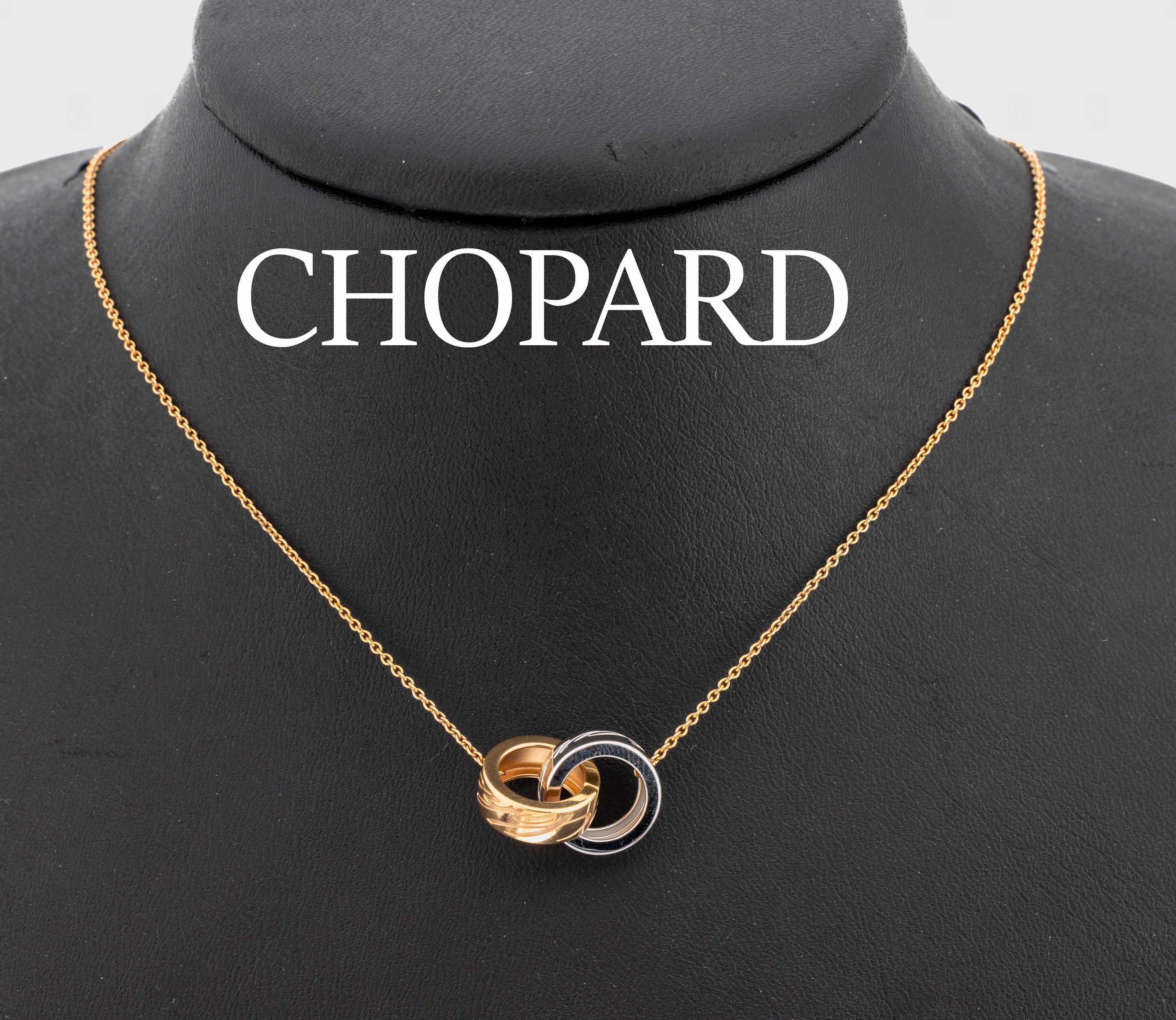 18 kt Gold CHOPARD Collier, RoseG/WG 750/000, verschlungene Ringe, sign., L. ca. 40.5 cm, ca. 6.4 g
