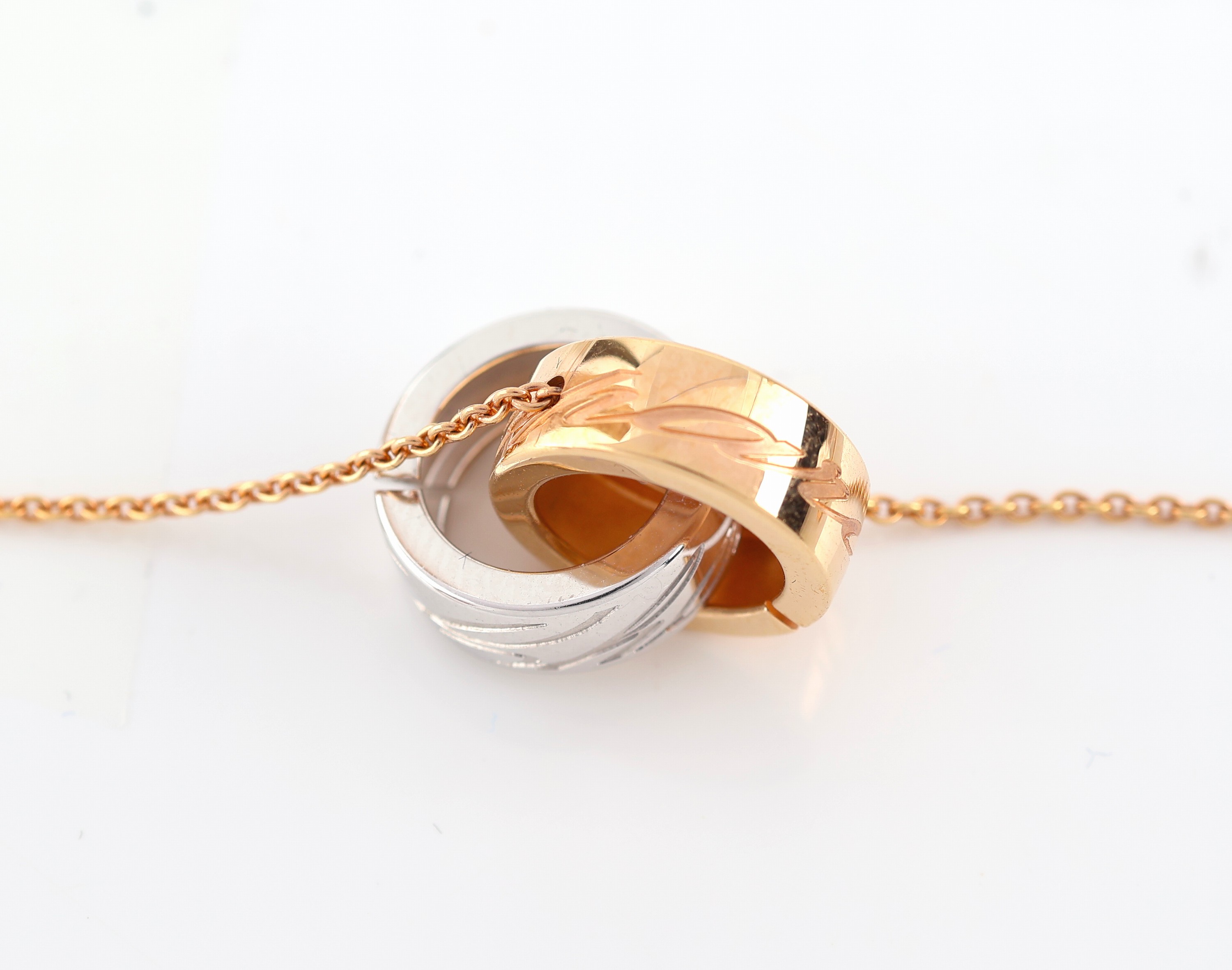Detail b: 18 kt Gold CHOPARD Collier, RoseG/WG 750/000, verschlungene Ringe, sign., L. ca. 40.5 cm, ca. 6.4 g