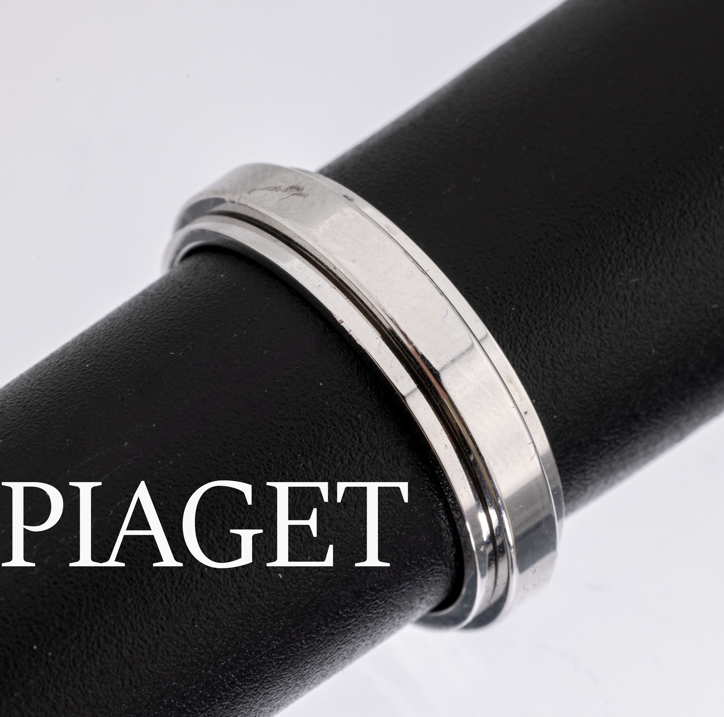 18 kt Gold PIAGET Ring, WG 750/000, mittlere Schiene drehbar, RW 55, sign. und num., ca. 6.3 g