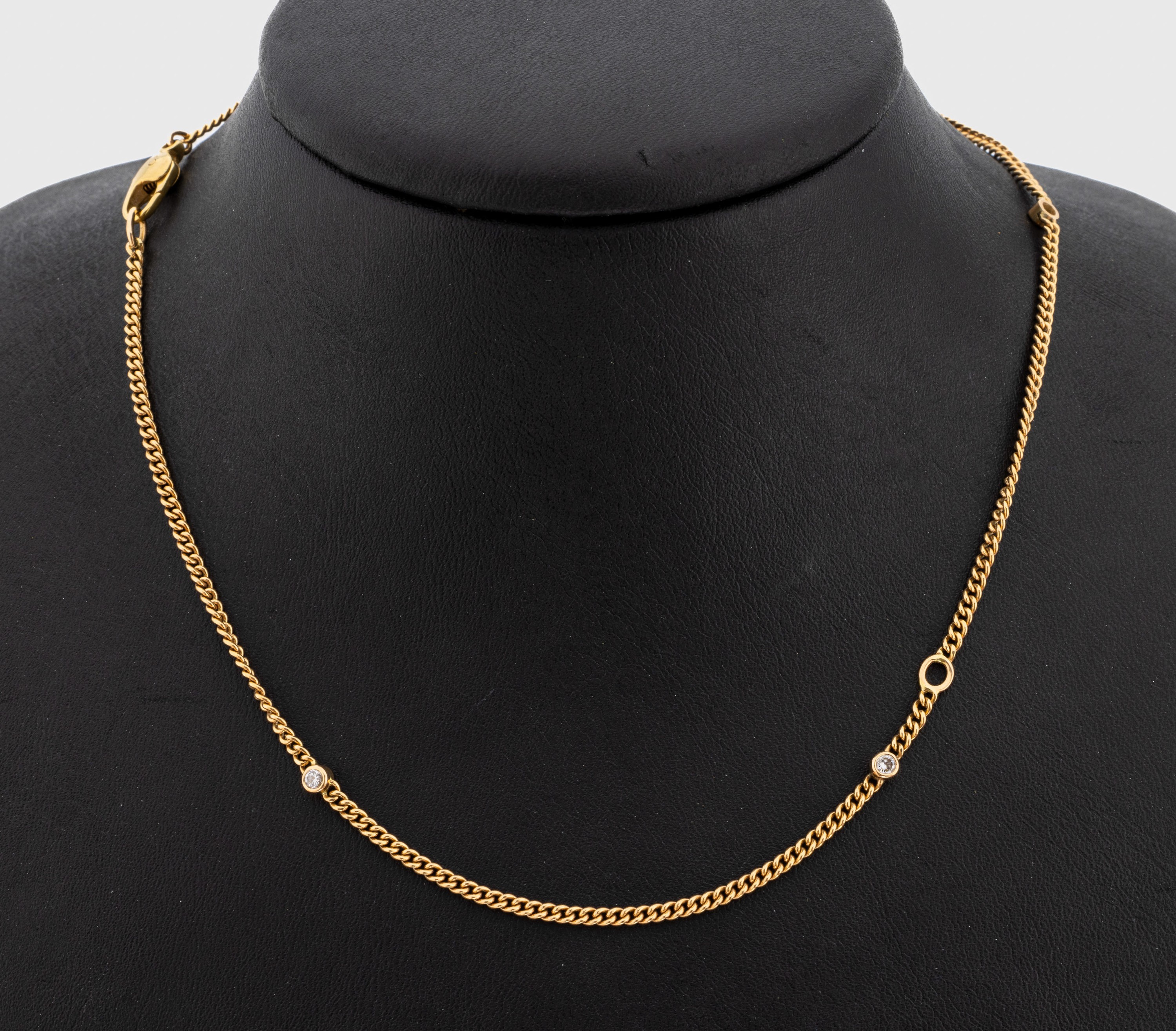 18 kt Gold Brillant-Collier, GG 750/000, 12Brillanten zus. ca. 0.60 ct Weiß/si, L. ca. 95cm, Karabinerschließe, ca. 18.1 g
