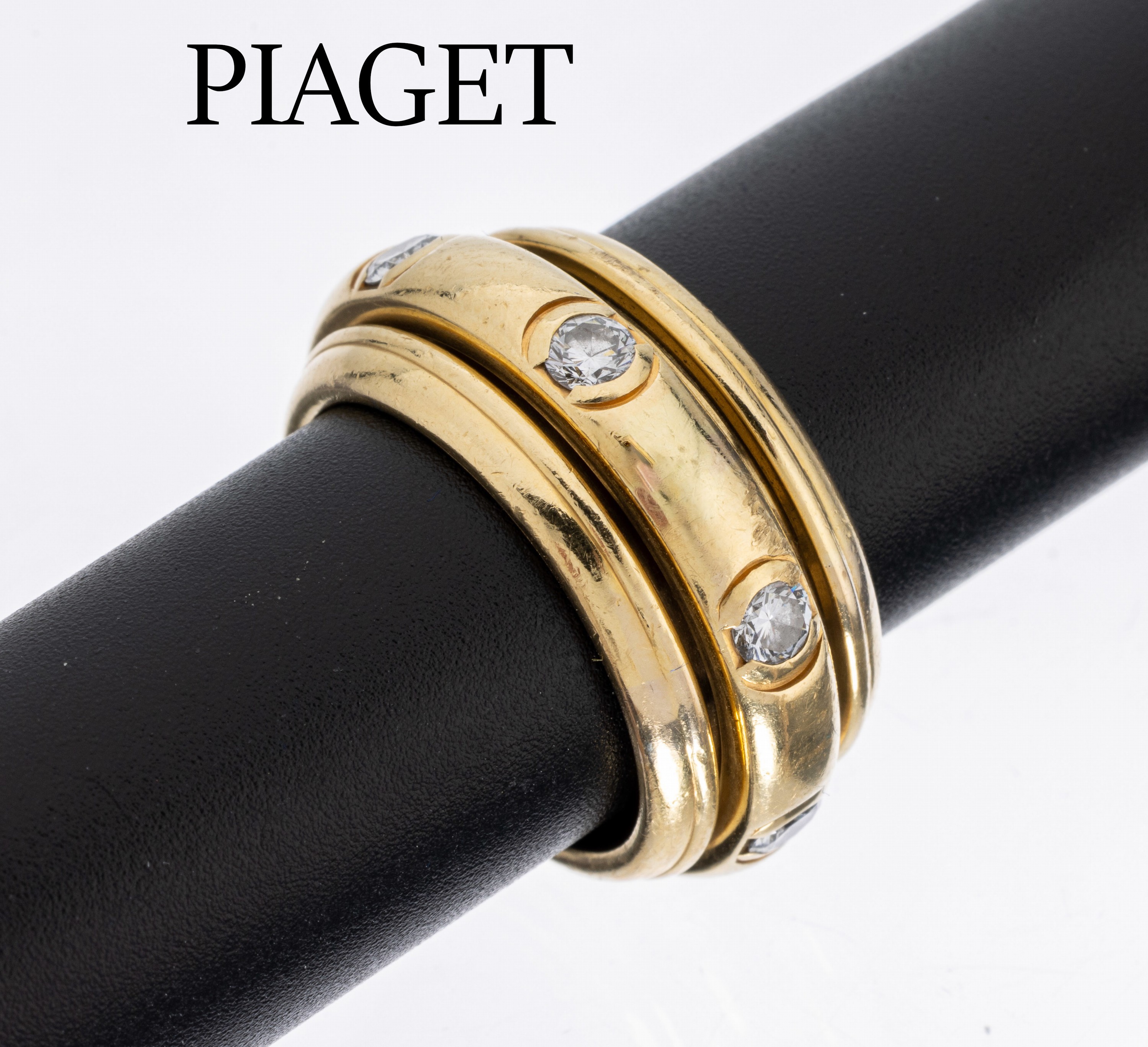 18 kt Gold PIAGET Brillant-Ring, GG 750/000, Model Possession, mittlere Ringschiene drehbar, 7 Brillanten zus. ca. 0.90 ct feines Weiß/vs, RW 53, ...