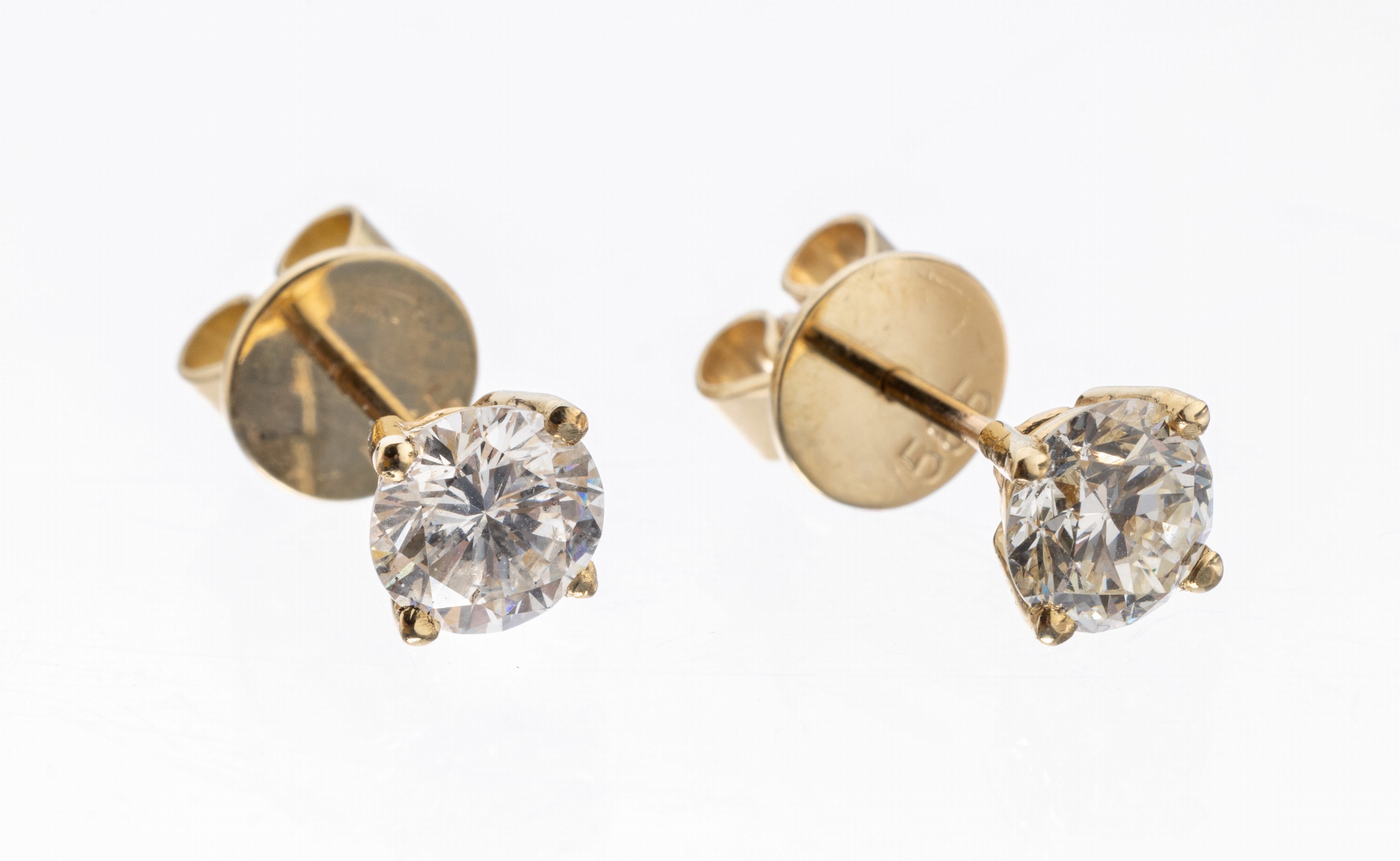 Paar 14 kt Gold Brillant-Ohrstecker, GG 585/000, 2 Brillanten zus. ca. 1.31 ct Weiß- l.get.Weiß/si-p