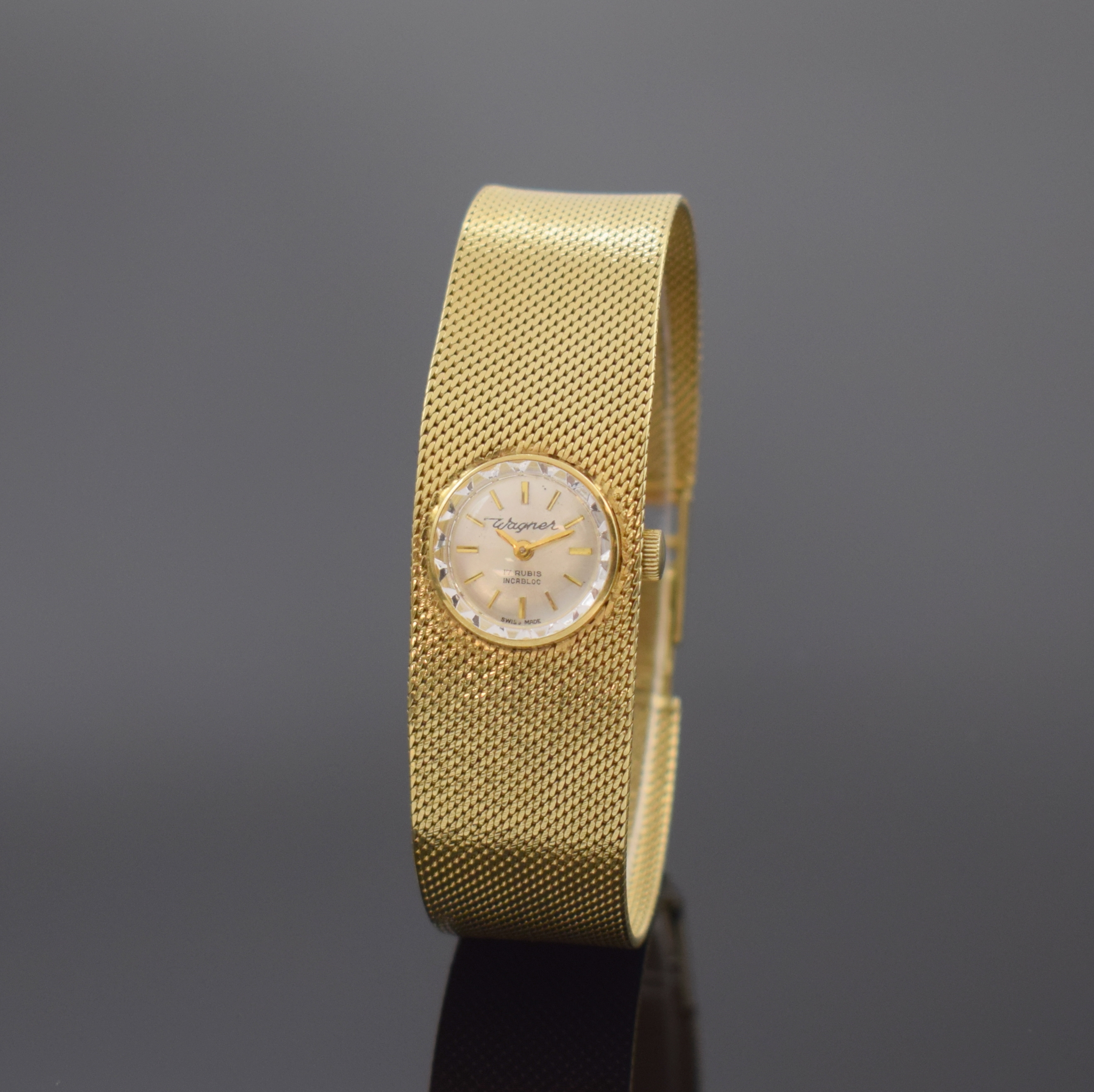 WAGNER Damenarmbanduhr in GG 585/000, Schweiz um 1965, Handaufzug, Boden m. Monogramm aufgedr., silb. Zifferbl. m. gold. Std.-Ind., gold. Zeiger, ...