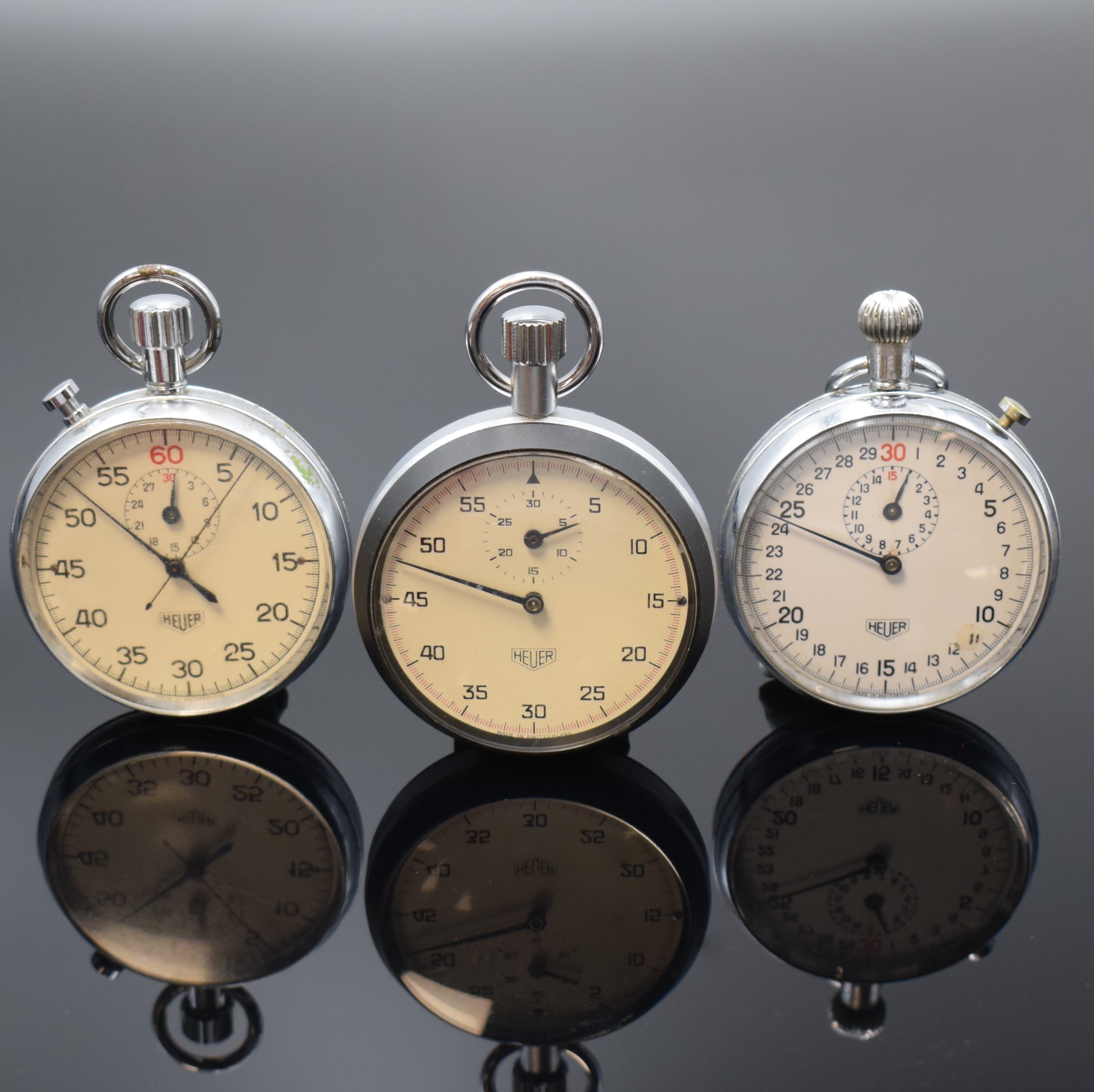 Konvolut: 3 HEUER Einhandstoppuhren, verchromte Gehäuse, Böden und Glasränder aufgedr., 1 x Split-Second um 1968, Kal. 736, Incabl., 1 x um 1970, ...