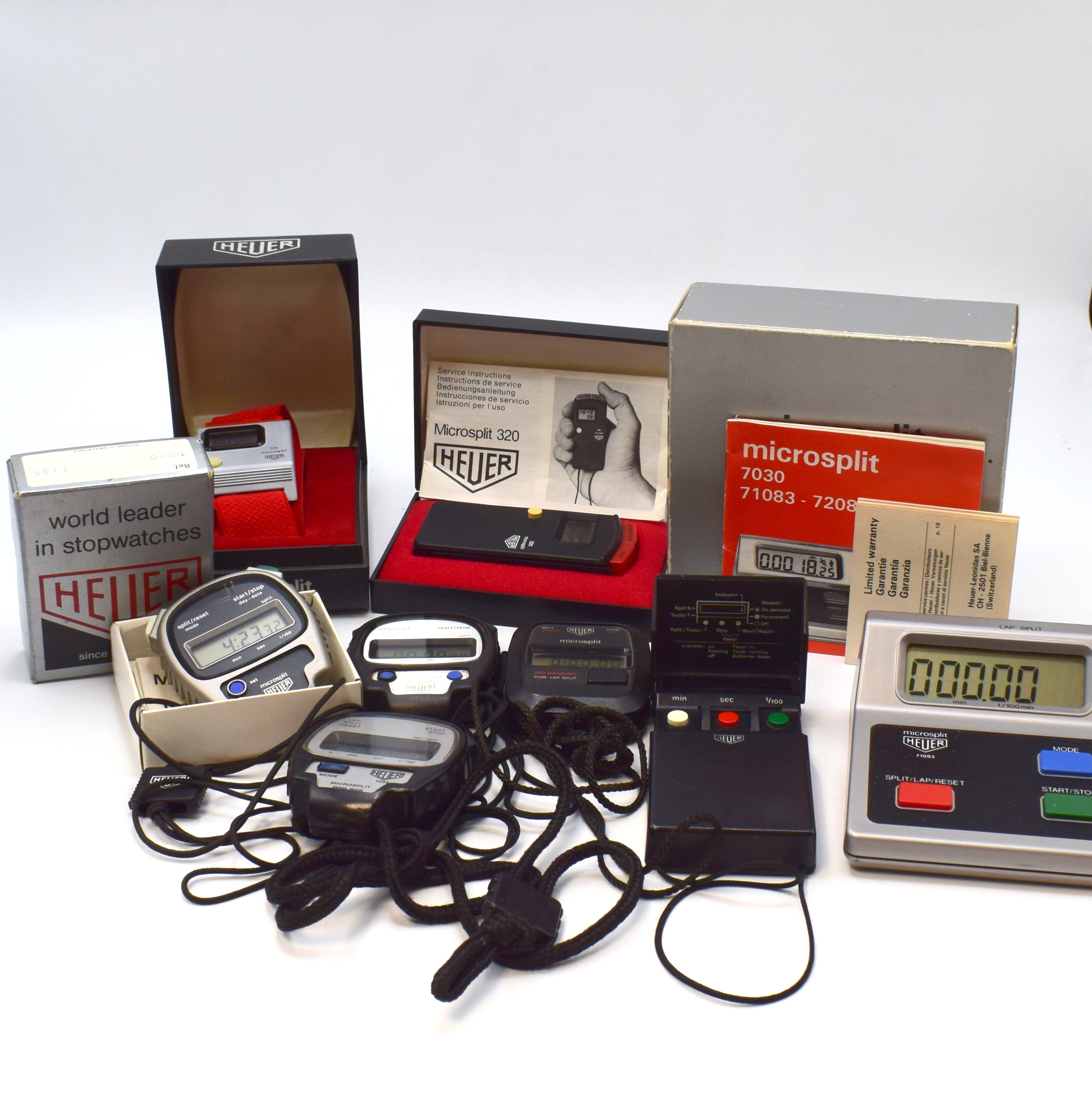 HEUER Microsplit 8 digitale Stoppuhren, Schweiz ca. 1970er Jahre, quartz, Kunststoff/Metallgeh., 4 Handmodelle: Ref. 230, 2 x 1000, 1030, 1 ...