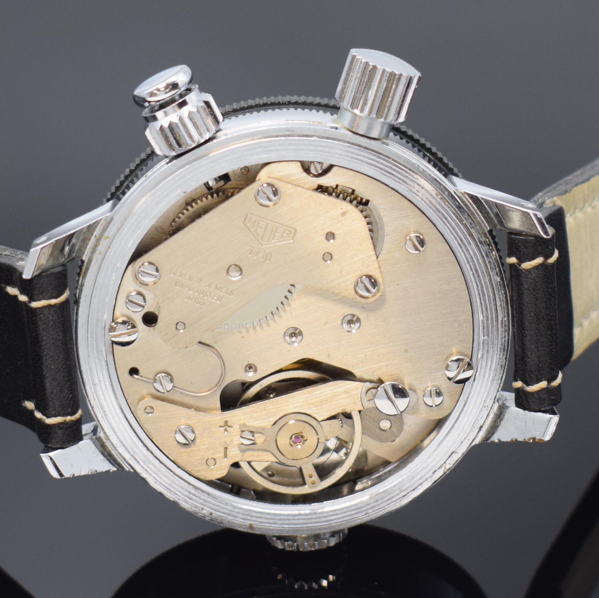 Detail e: HEUER Game-Master Armbandstoppuhr, Handaufzug, Schweiz um 1960, verchr. Geh. m. aufgedr. Stahlboden, beids. drehb. Lünette m. 60er Teilung ...