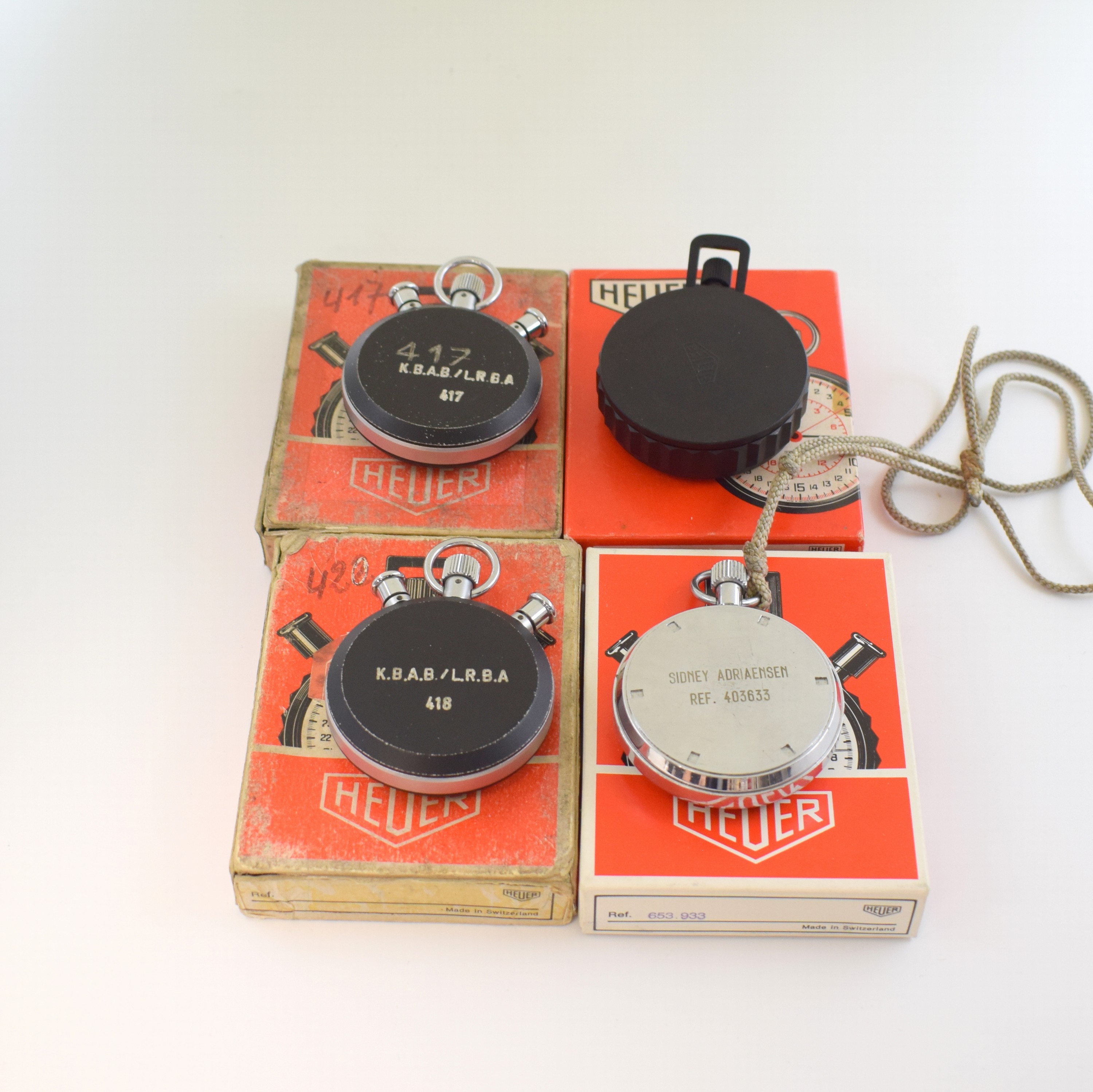 Detail c: HEUER 4 Stoppuhren in original Box, Schweiz um 1960/1970, Geh. m. aufgedr. Böden, 3 x verchr., 1 x Fiberglass, 2 x Rattrapante Kal. Valjoux 57 m. ...