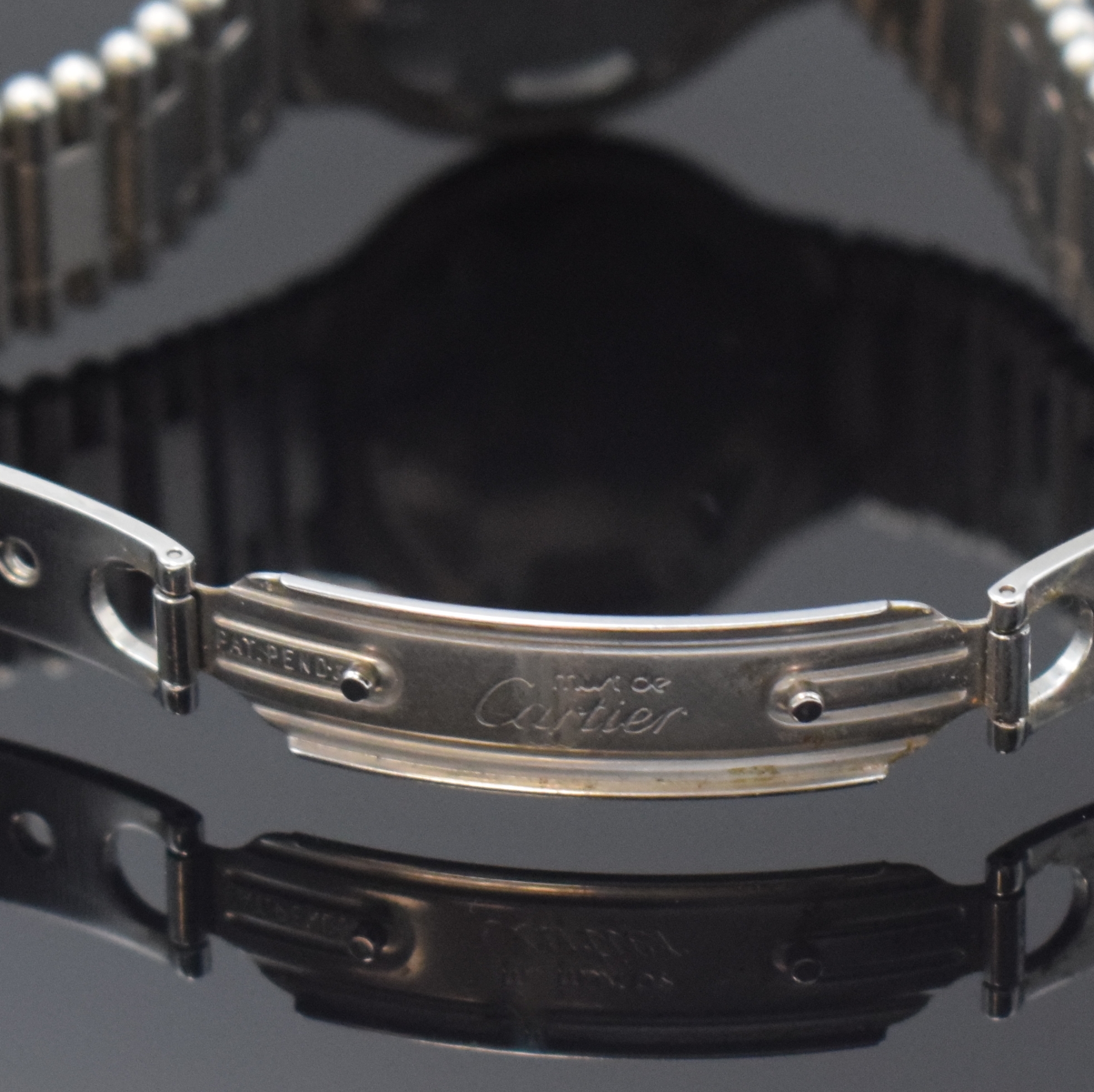 Detail b: CARTIER Linie 21 Armbanduhr, Schweiz um 1990, quarz, z. T. verg. Edelstahlgeh. inkl. orig. Gliederband m. dopp. Faltschl., Boden 6-fach verschr., ...