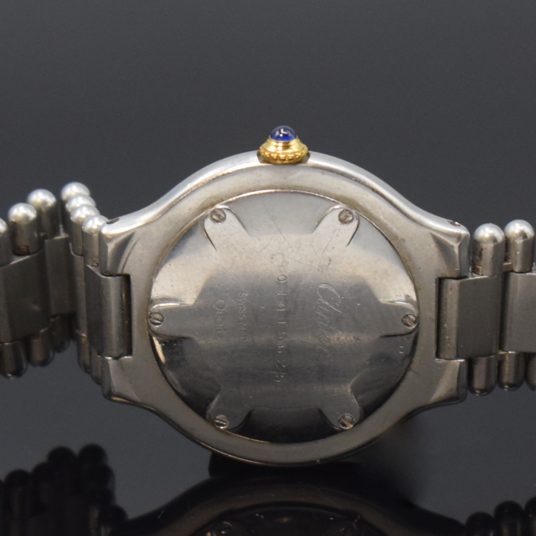 Detail d: CARTIER Linie 21 Armbanduhr, Schweiz um 1990, quarz, z. T. verg. Edelstahlgeh. inkl. orig. Gliederband m. dopp. Faltschl., Boden 6-fach verschr., ...