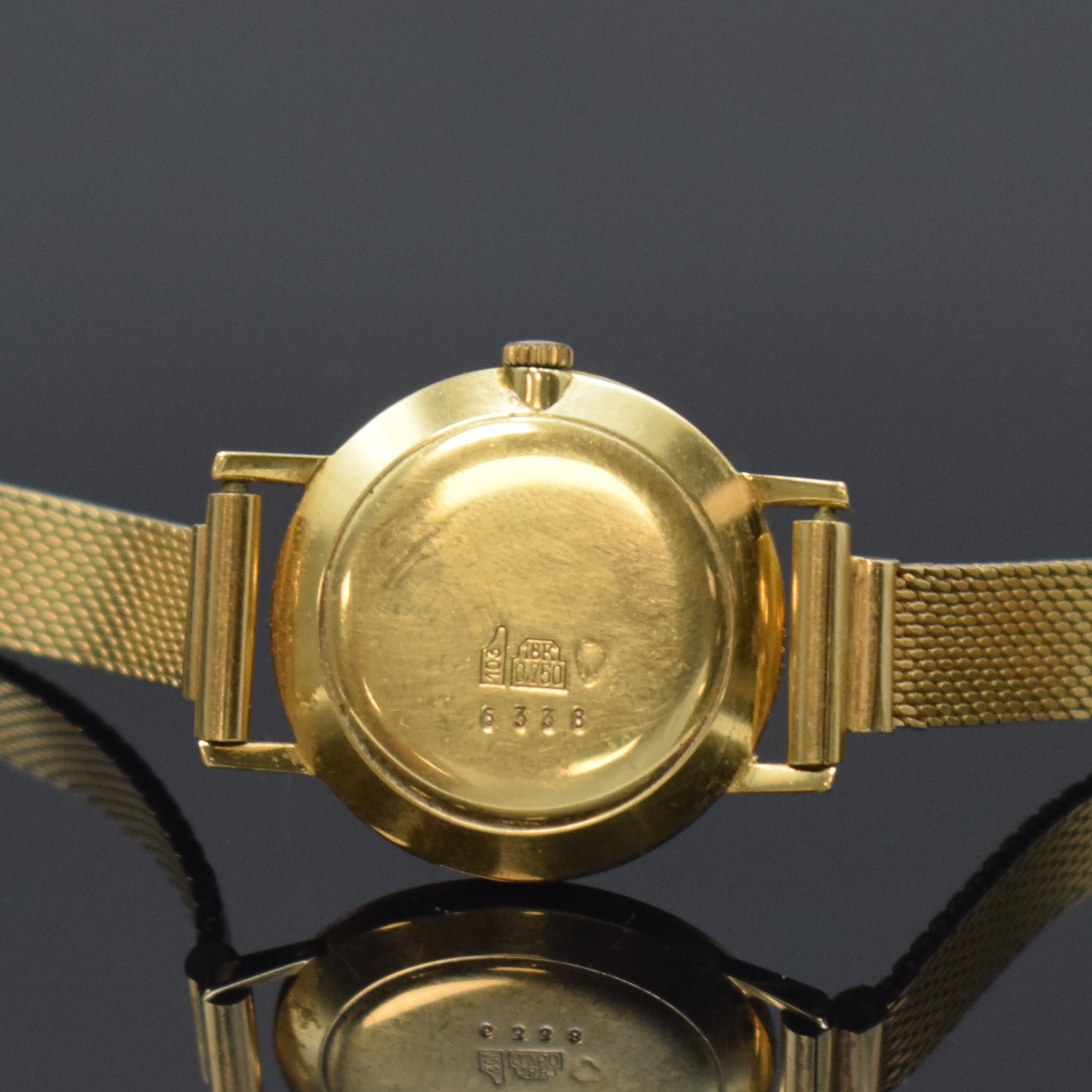 Detail c: HENO Damenarmbanduhr in GG 750/000, Schweiz um 1965, Handaufzug, Glasrand aufgedr., silb. Zifferbl. m. gold. Indizes und Zeigern, D. ca. 25 mm, L. ...