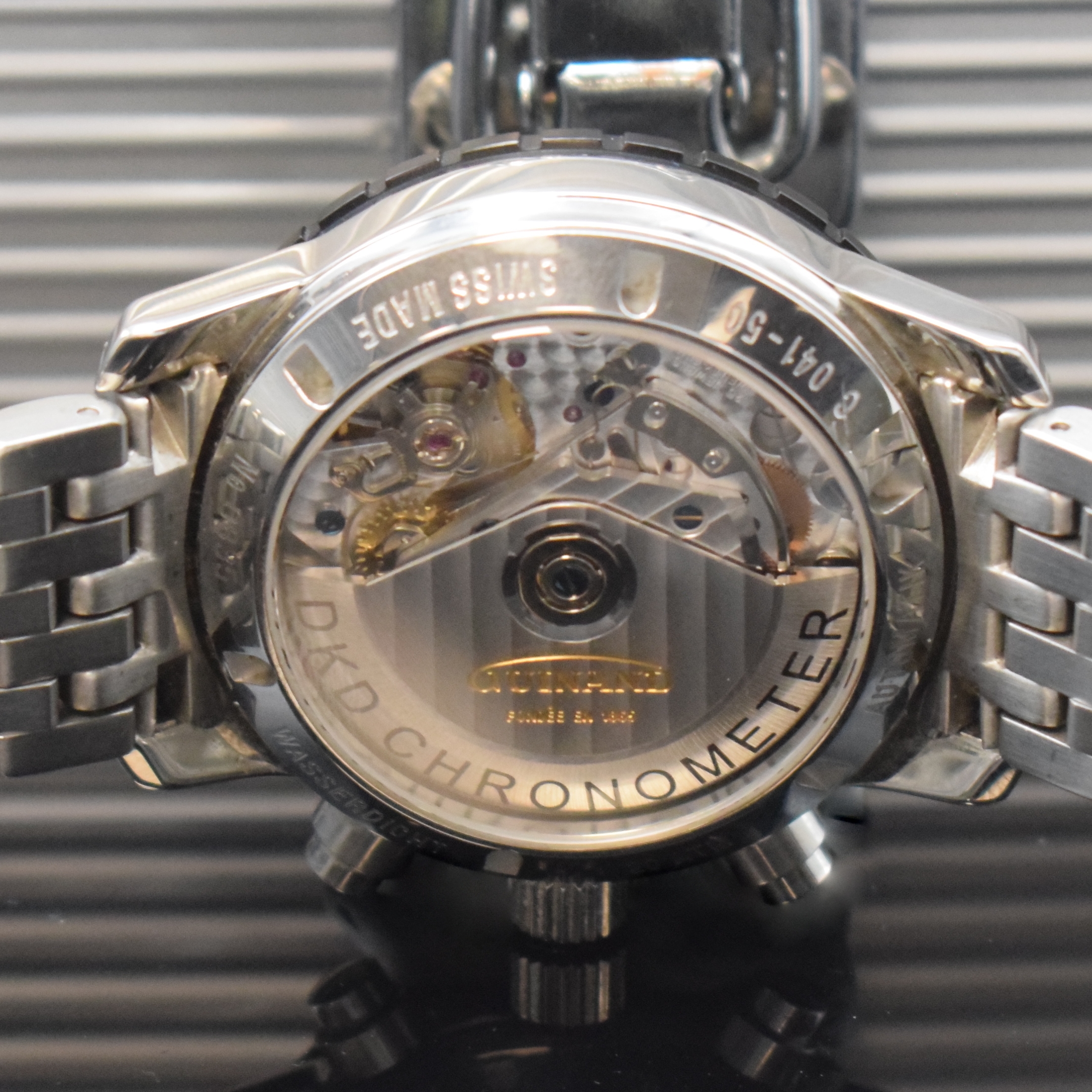 Detail d: GUINAND Chronometer Herrenchronograph, Schweiz 2010, Automatik, Edelstahlgeh. inkl. neutr. Gliederband m. dopp. Faltschl., beids. vergl., Boden u. ...