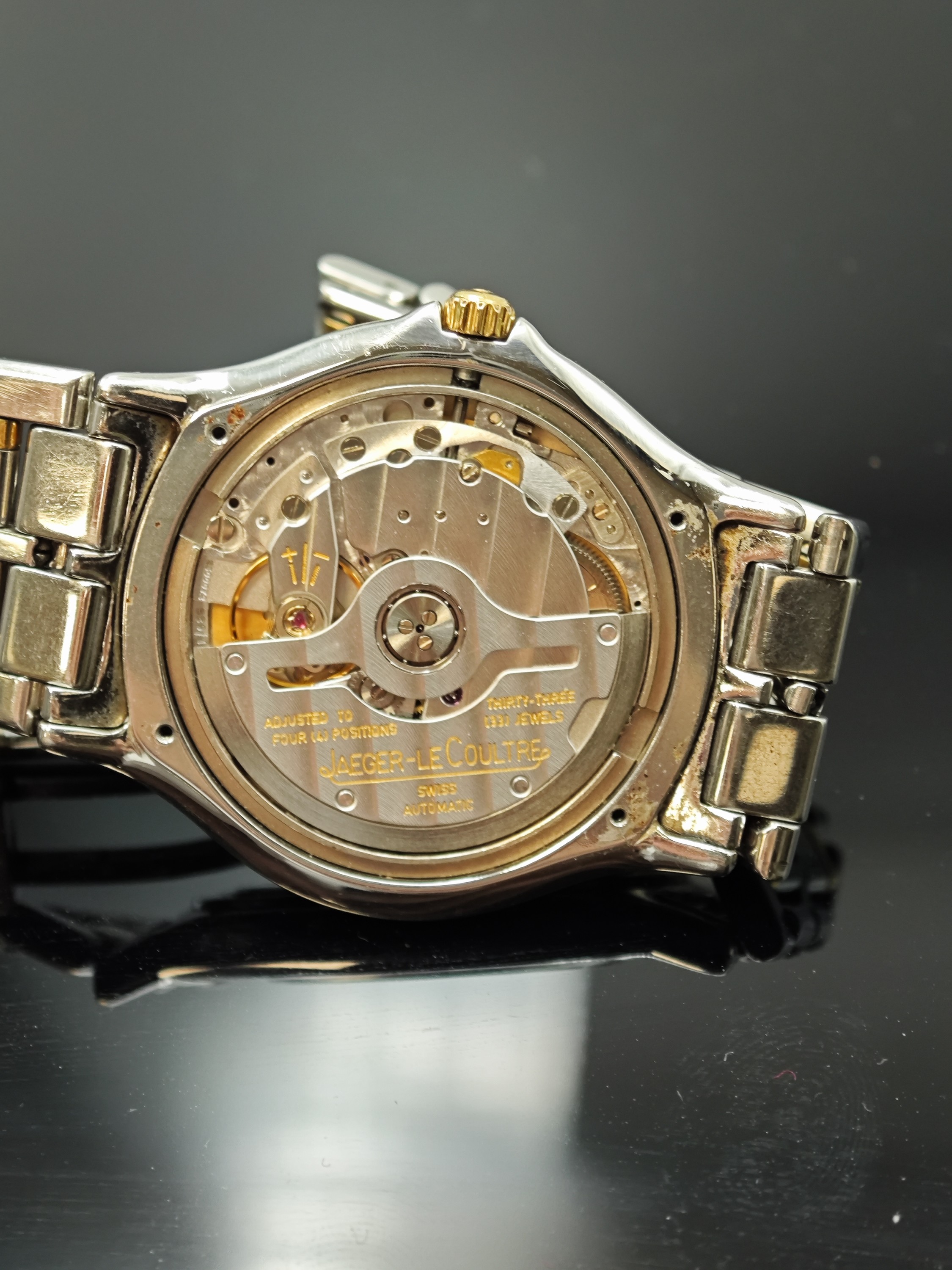 Detail e: Jaeger-LeCoultre Heraion Armbanduhr in Stahl/Gold Referenz 114.5.89, Schweiz um 1990, Automatik, orig. Gliederband m. dopp. Faltschl., Boden m. ...