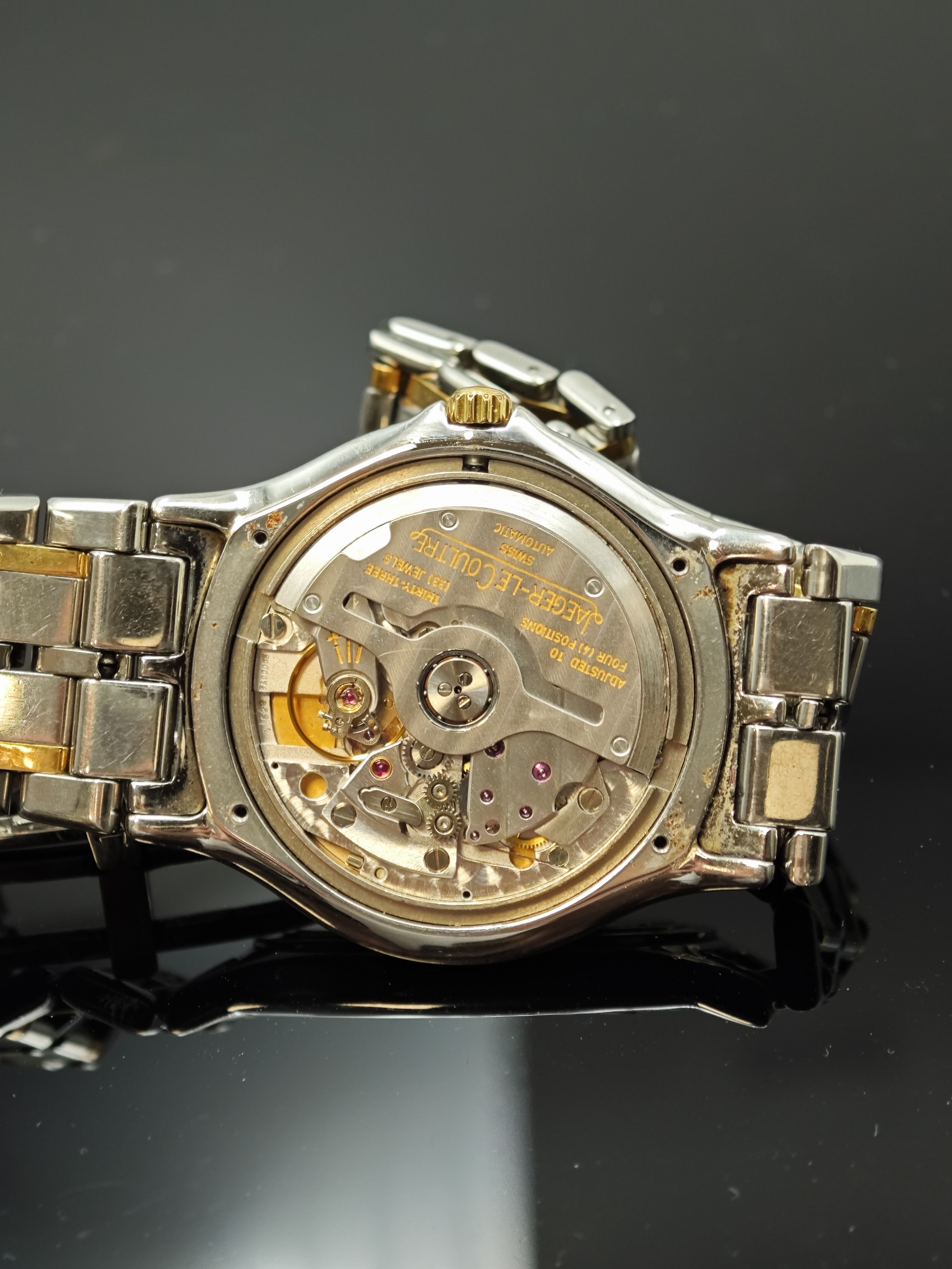 Detail f: Jaeger-LeCoultre Heraion Armbanduhr in Stahl/Gold Referenz 114.5.89, Schweiz um 1990, Automatik, orig. Gliederband m. dopp. Faltschl., Boden m. ...