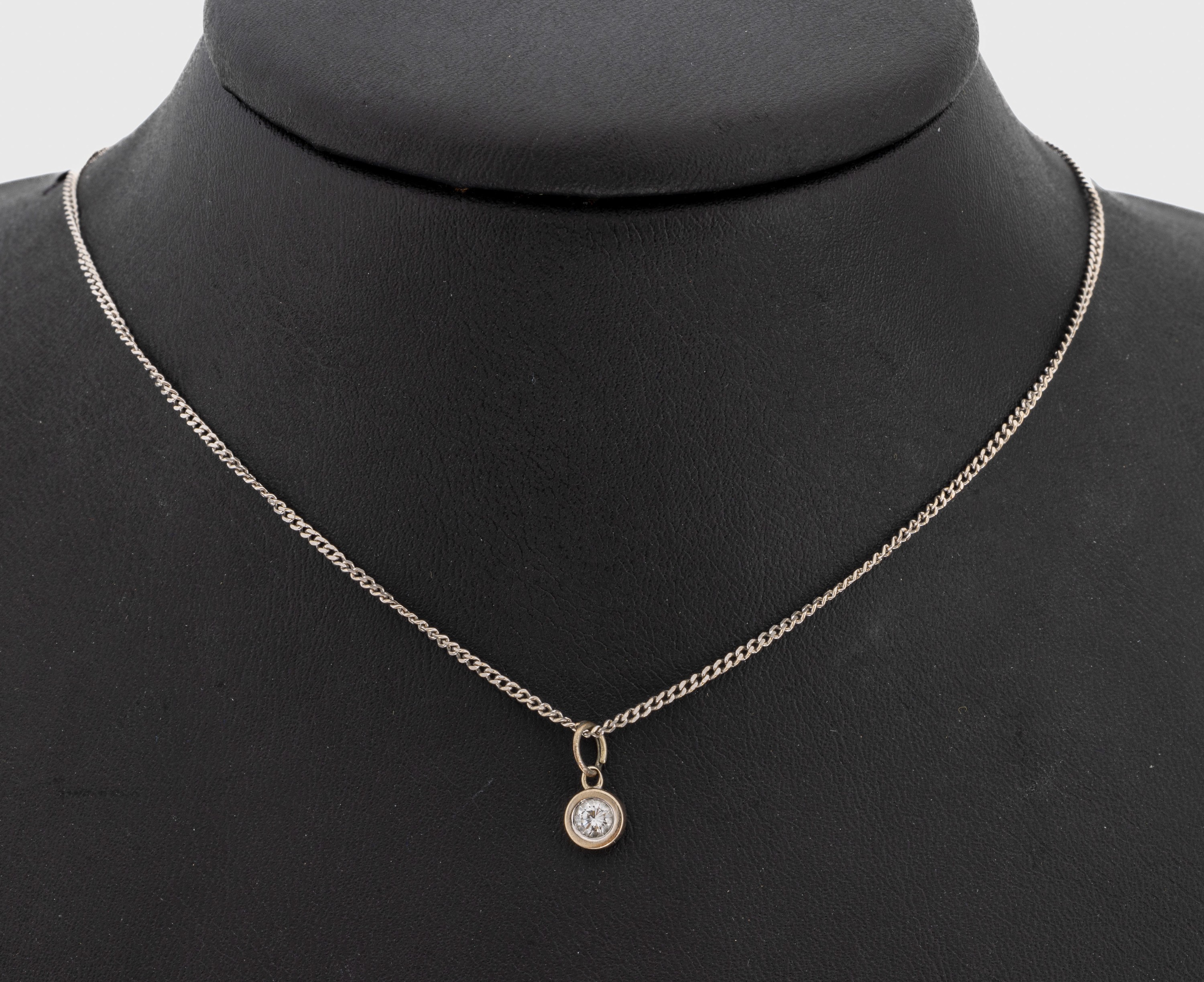 14 kt Gold Brillant-Anhänger, WG 585/000, Brillant ca. 0.15 ct Weiß/si, an 14 kt Gold Kette WG 585/000, L ca. 40 cm, Federring- schließe, ca. 2.6 ...