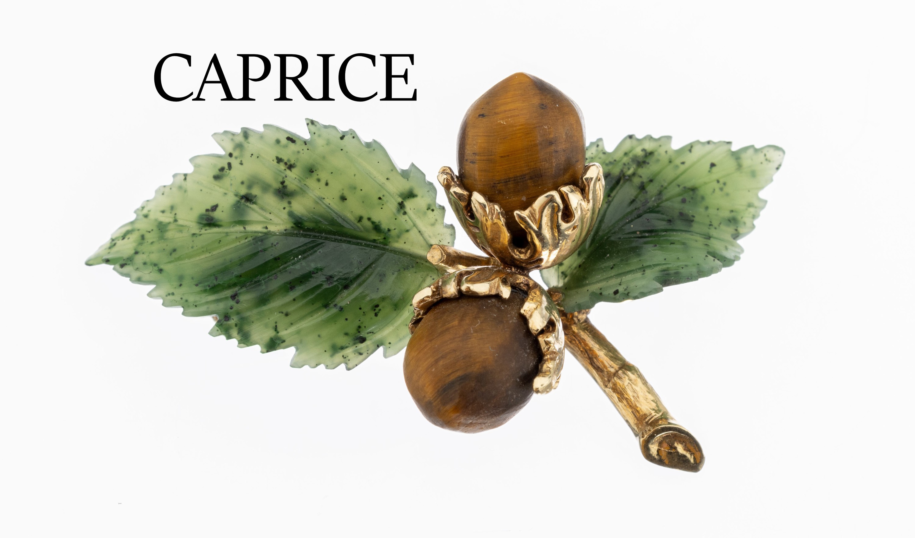 14 kt Gold CAPRICE Brosche, "Haselnüsse", GG 585/000, 2 Haselnüsse aus Tigerauge mit zwei Blättern aus Nephrit geschn. und geschl.,ca. ...