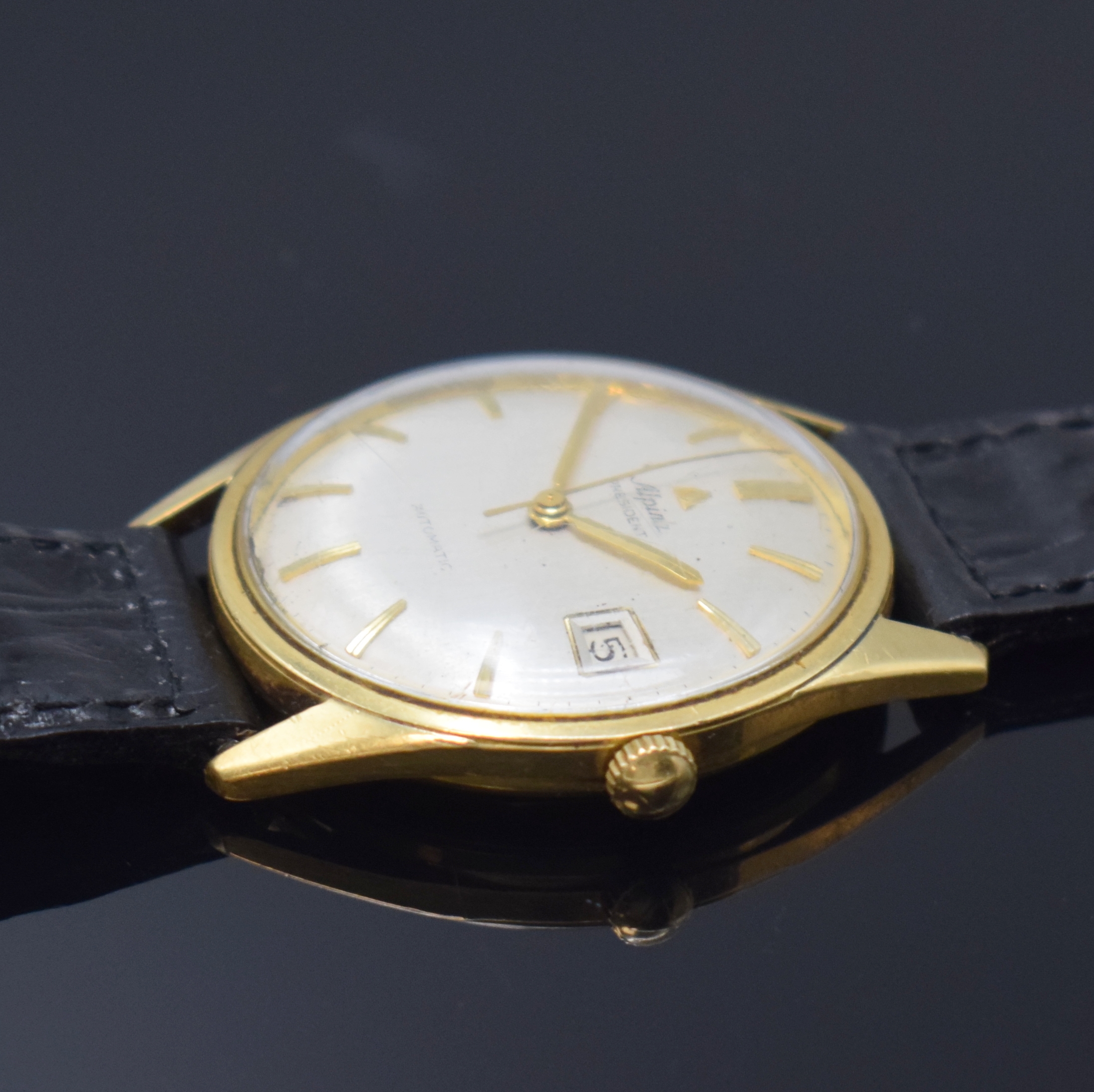 Detail b: ALPINA President Herrenarmbanduhr in GG 750/000, Automatik, Schweiz 1960er Jahre, Boden geschr., silb. Zifferbl. m. aufgel. Indizes, Zentralsek., ...