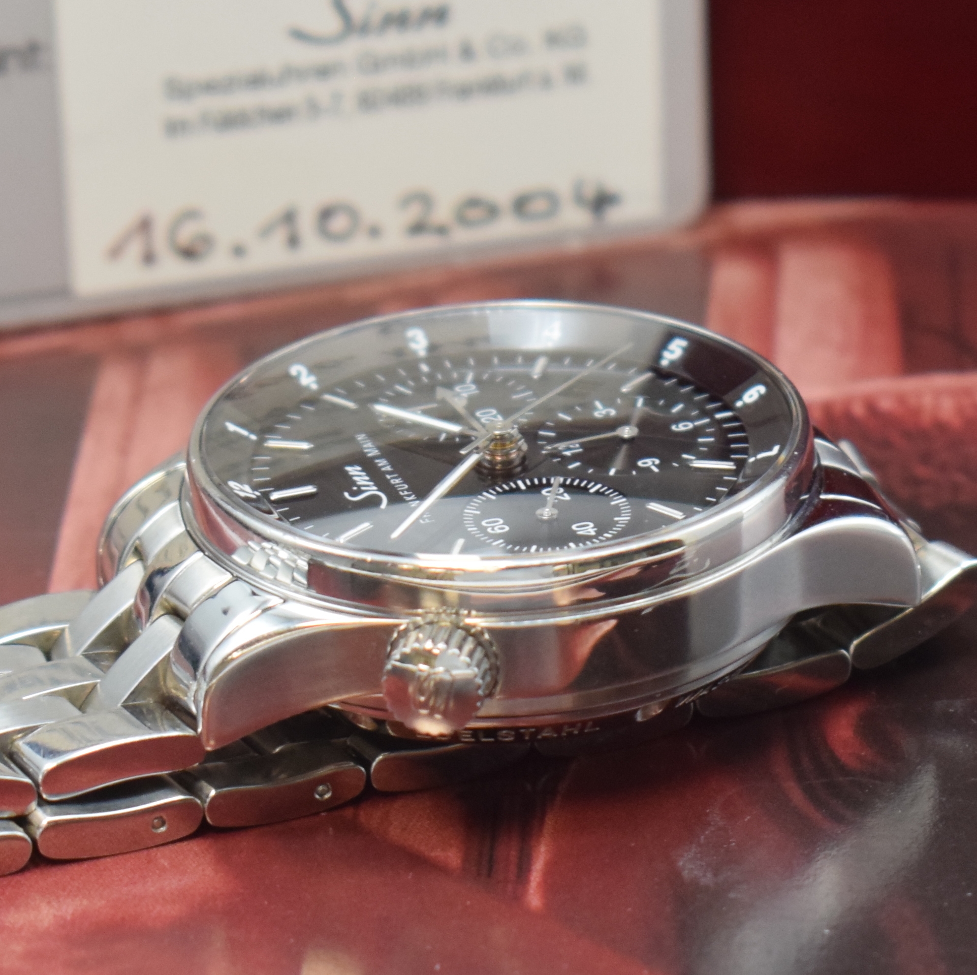 Detail d: SINN Herrenarmbanduhr "Die Finanzplatzuhr" Referenz 6000, Automatik, Edelstahlgeh. inkl. Gliederband m. dopp. Faltschl., beids. ...