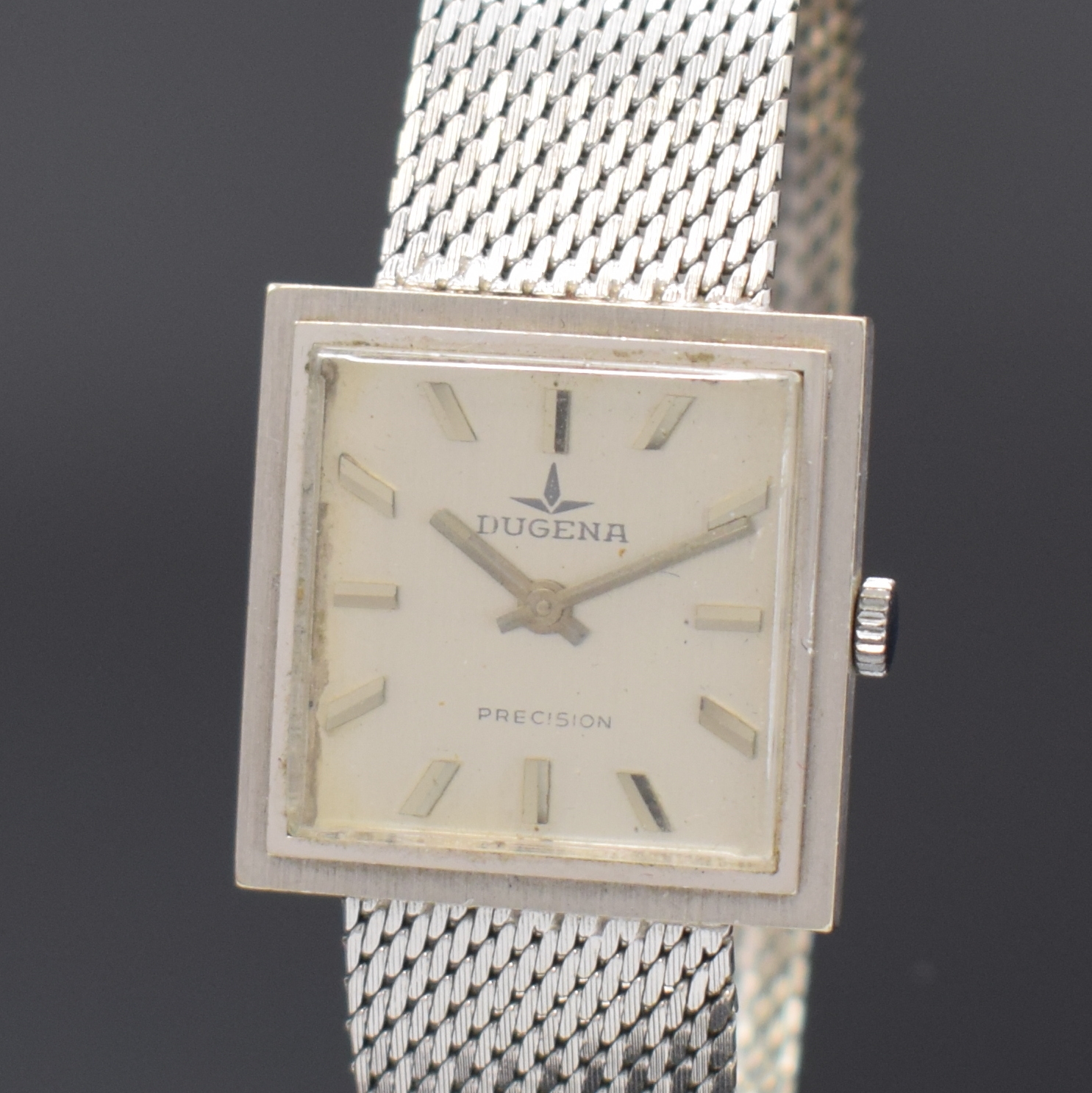 Detail a: DUGENA Precision Herrenarmbanduhr in WG 750/000, Handaufzug, Deutschland/Schweiz um 1960, 2-tlg. Geh., Boden aufgedr., silb. Zifferbl. m. aufgel. ...