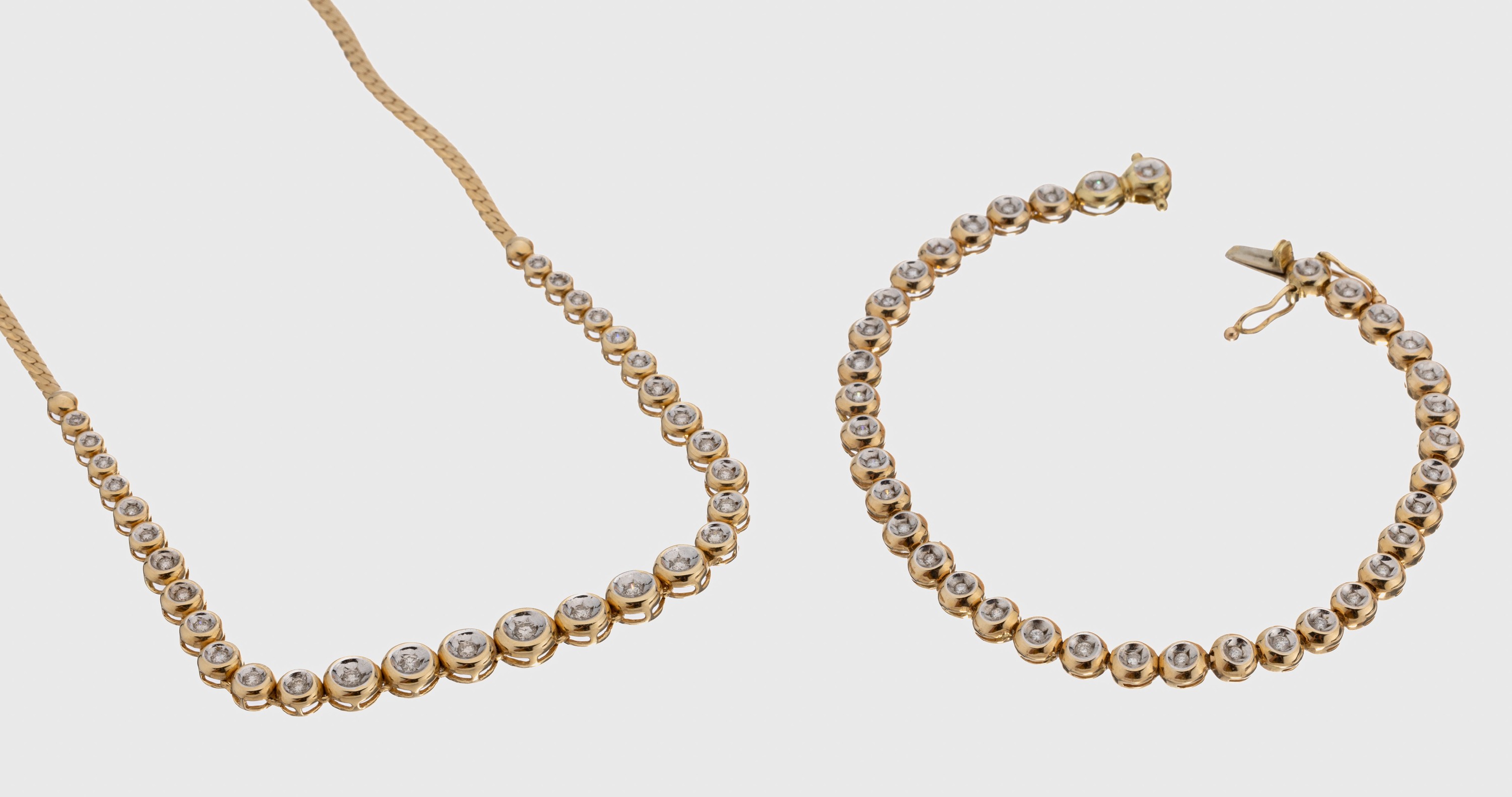 14 kt Gold Brillant-Schmuckset, GG 585/000, best aus: Collier und Armband, Collier mit 31 Brillanten im Verlauf zus. ca. 0.40 ct ...