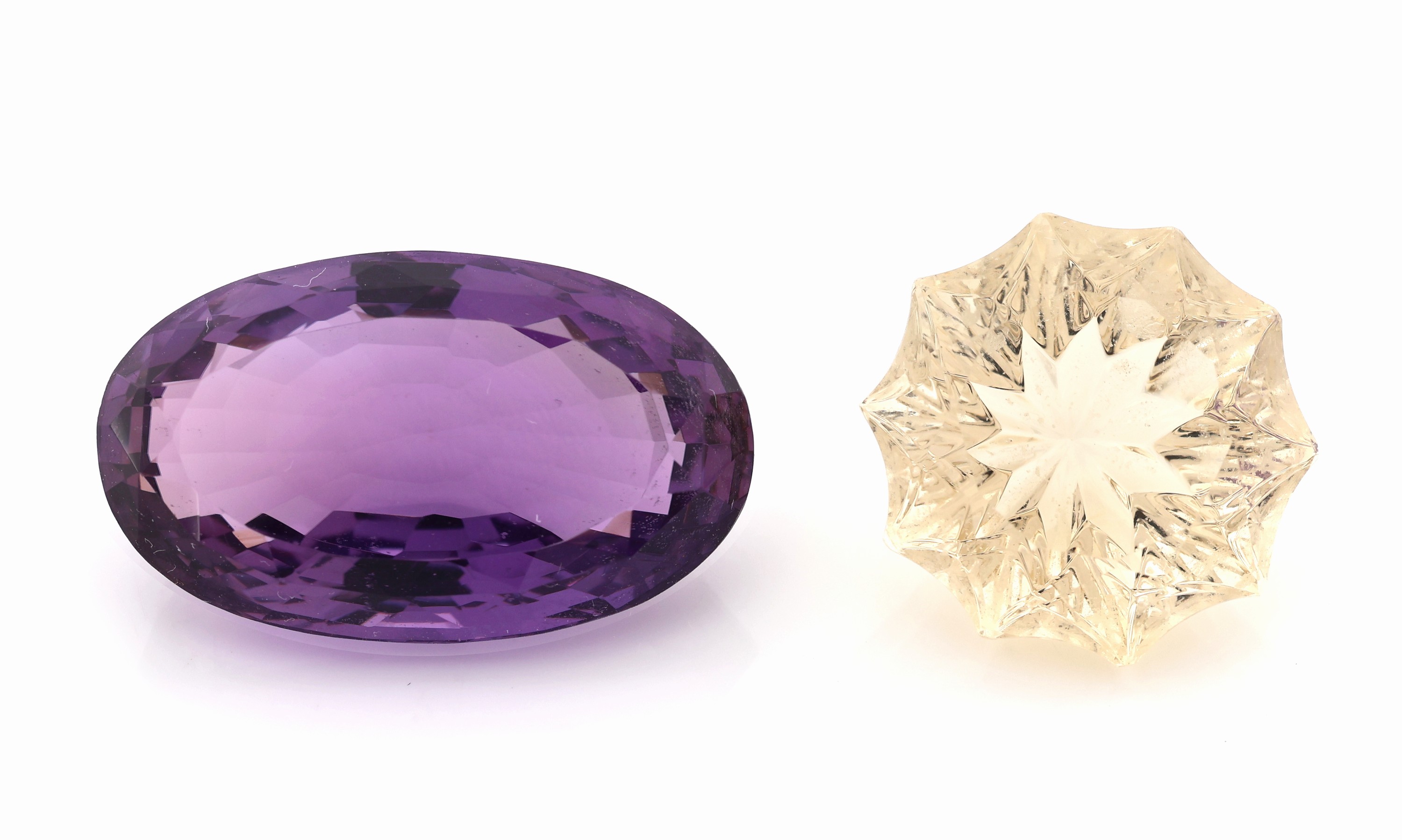 Lot 2 lose Farbsteine, 1 x ovalfacett. Amethyst ca. 22.23 ct, 1 x Citrin im Fantasieschliff ca. 14.75 ct